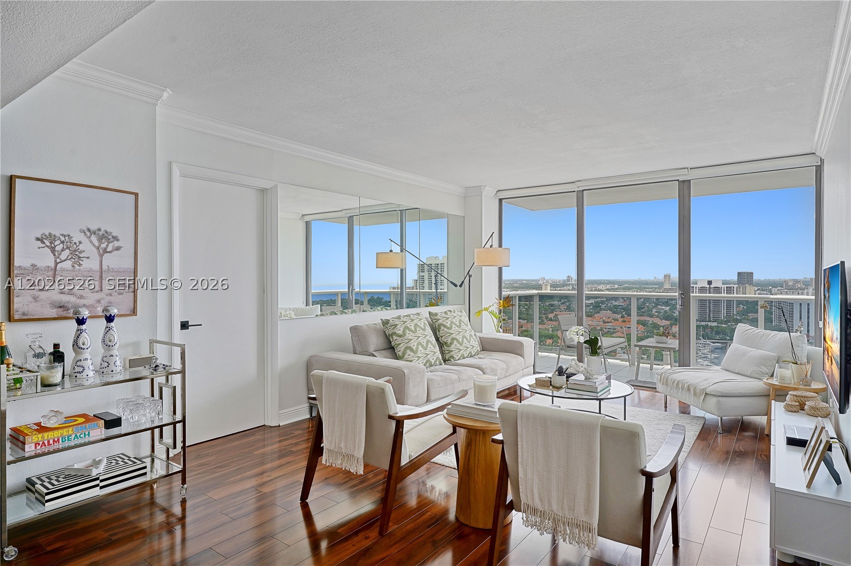 Welcome to this amazing oportunity to live close to the sky, from this turnkey and renovated 2-bedroom, 2-bath with stunning panoramic views of the ocean and coastal skyline. Don't miss this great opportunity to call this property your home. On the 26th floor of Eldorado Towers in desirable Aventura location; fall in love the moment you enter this beautifully renovated residence offering breathtaking views day and night. Bright and spacious with a split floor plan, this home features upgraded wood kitchen cabinets, granite countertops, and stainless steel appliances. Beautiful wood floors throughout, generous closet space, and room for a possible home office. Relax on the open balcony while enjoying panoramic views day and night—watch manatees and dolphins in the waterway below. Unit is sold fully furnished and move-in ready. Building Amenities offer a New Olympic-size pool, jacuzzi, sauna, clubhouse, tennis courts, fitness center, New BBQ area, and more. Blding has FULL RESERVES. Seller will pay off all special assessments at closing. Internet and cable included in maintenance fee. Prime Aventura location walk to Aventura Mall and step out to the Don Soffer 3-mile exercise trail surrounding the golf course. Just 5 minutes to the beach, 20 minutes to Fortlauderdale Airport. This renovated high-floor condo with spectacular views is an opportunity you Don’t want to miss! No Leasing firts 2 years.