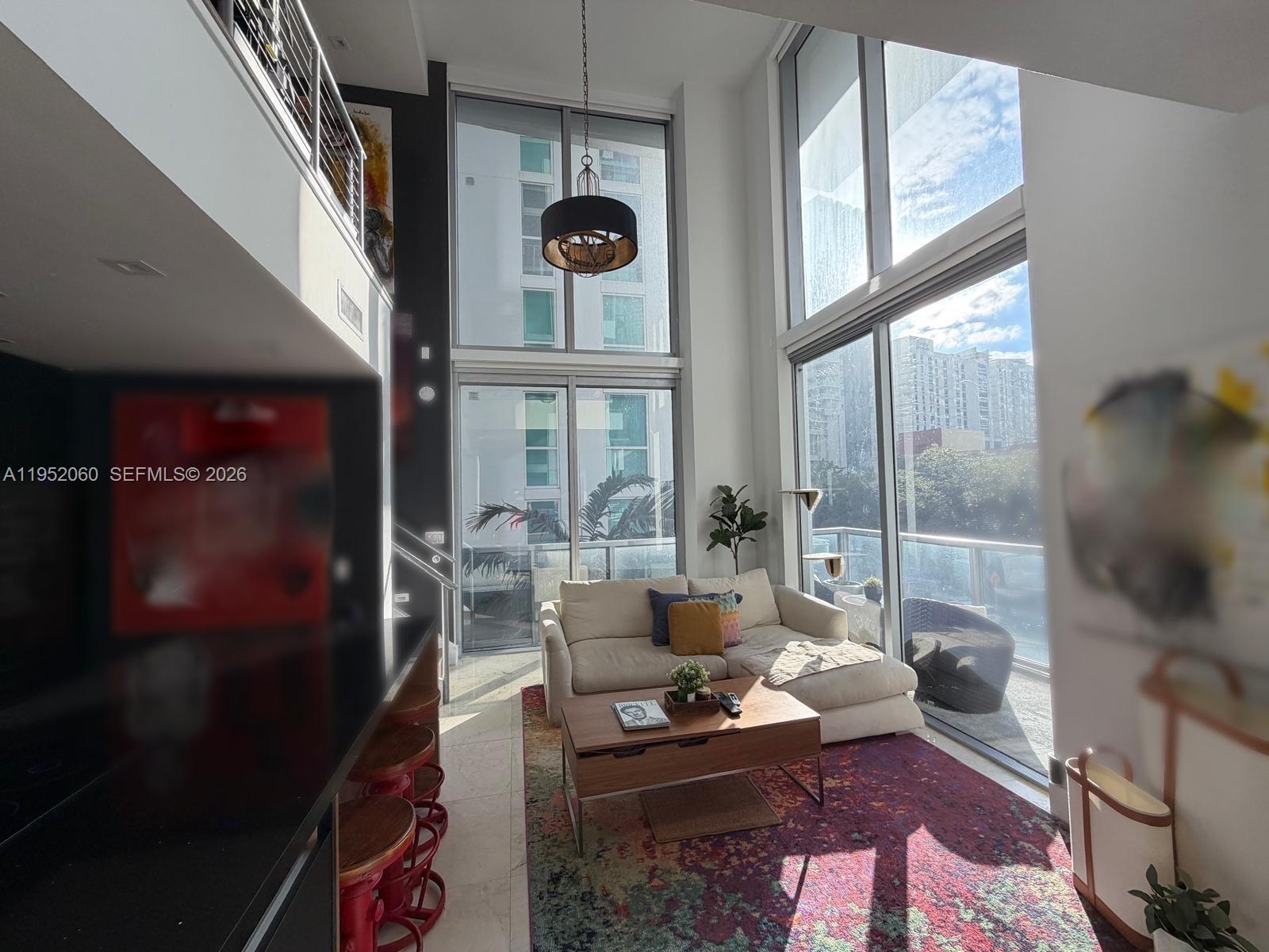 “Step into this super-modern, completely remodeled loft in the heart of Brickell, where design meets technology. Spanning 1,167 SF, includes 1 bedroom, 2 full bathrooms and a Den, 1 assigned parking space. This stunning residence features motorized shades throughout, an upgraded chef’s kitchen, Lutron lighting sets the mood, and CAT6 wiring for seamless internet, sound, and home automation. Enjoy peace of mind with a 1-year-old A/C and water heater, plus the rare convenience of the A/C unit located just outside the apartment. Sleek, sophisticated, and effortless city living.