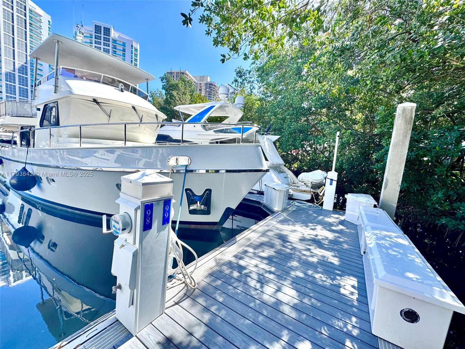 Rarely listed! Own a rare 60-foot x 17.5-foot deeded boat slip on a floating dock in the fully renovated and prestigious Mystic Pointe Marina, located in the heart of Aventura! Enjoy the convenience of a floating dock—no tide concerns—within a gated community offering 24-hour security. Dockmaster on premise. Residency is not required to own. Features include 30-50 Amp service, water, electric, and cable. Deep water access with no fixed bridges—just 20 minutes to the ocean via Haulover Inlet, 55 minutes north to Fort Lauderdale, and only 40 miles from the Bahamas. Residency not required for tenancy. HOA: $494.00 /month + $585.00 /quarter. No liveaboards.