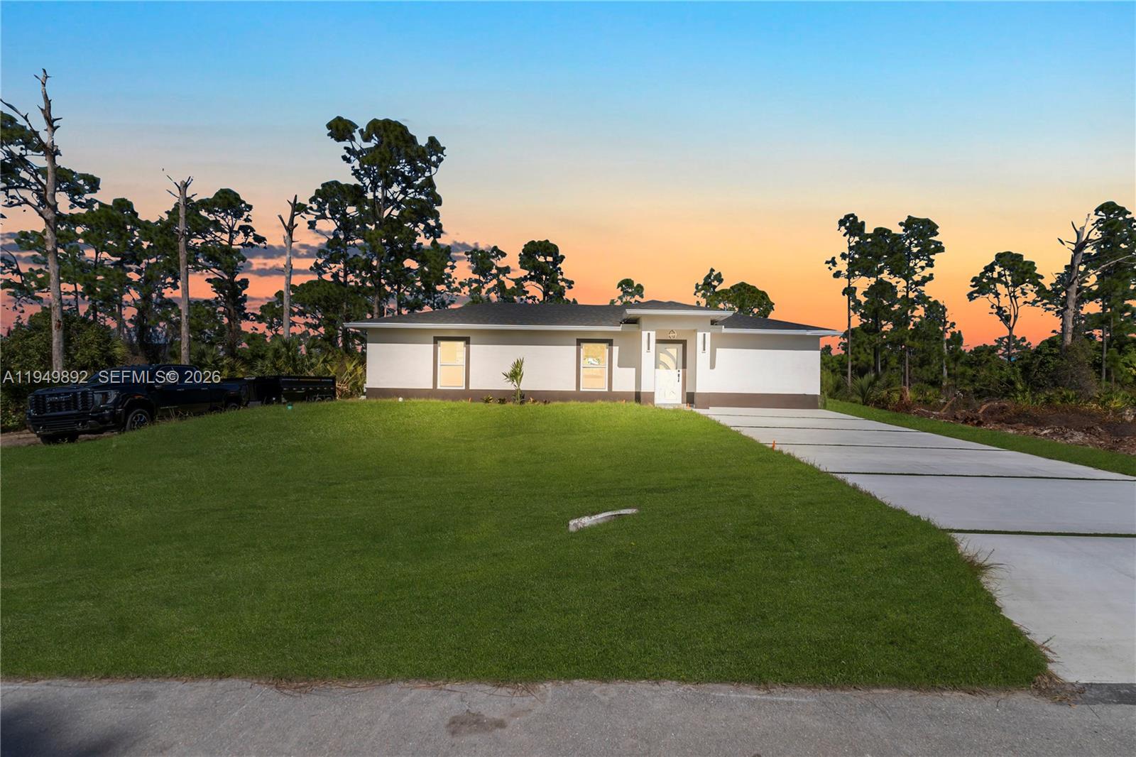Beautiful new construction in a quiet and growing area of Lehigh Acres. This modern home features high-quality appliances, elegant finishes, and porcelain tile throughout. Enjoy a spacious terrace with outdoor kitchen, side access for truck or trailer, and a large backyard with room for a pool. Conveniently located near SR-82 with easy access to Fort Myers and surrounded by newer construction homes.