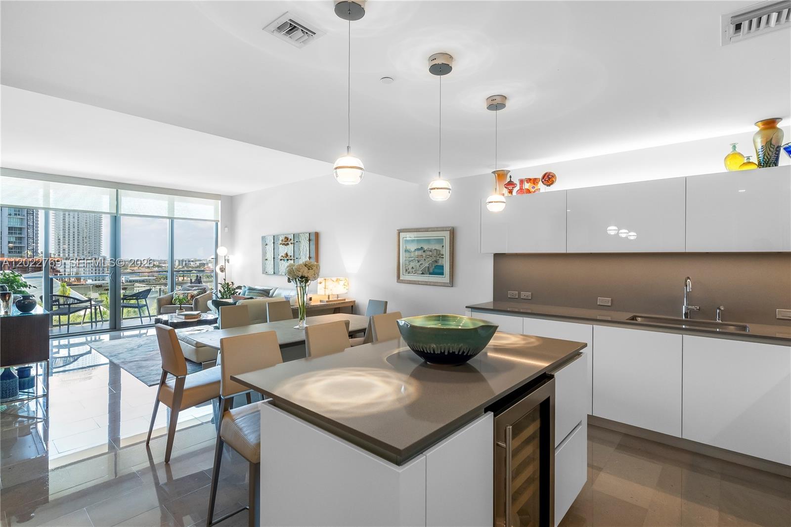 Offered partially furnished, this contemporary 2 bedroom, 2 bathroom residence showcases an open-concept layout and more than $30K in upgrades, including custom Italkraft closets, designer lighting, and premium window treatments. Elegantly finished with stone flooring throughout, quartz countertops, ItalKraft cabinetry and Bosch appliances. Enjoy sunset views and passing boats along the Miami River from the expansive 200-square-foot terrace, accessible from every room; one assigned parking space included. Located within the acclaimed Brickell City Centre, Reach is a full-service luxury building offering 24/7 security, attended lobby, fitness center, salon, spa, and resort-style pool. Just steps from premier dining and shopping, and only 15 minutes from Miami International Airport.