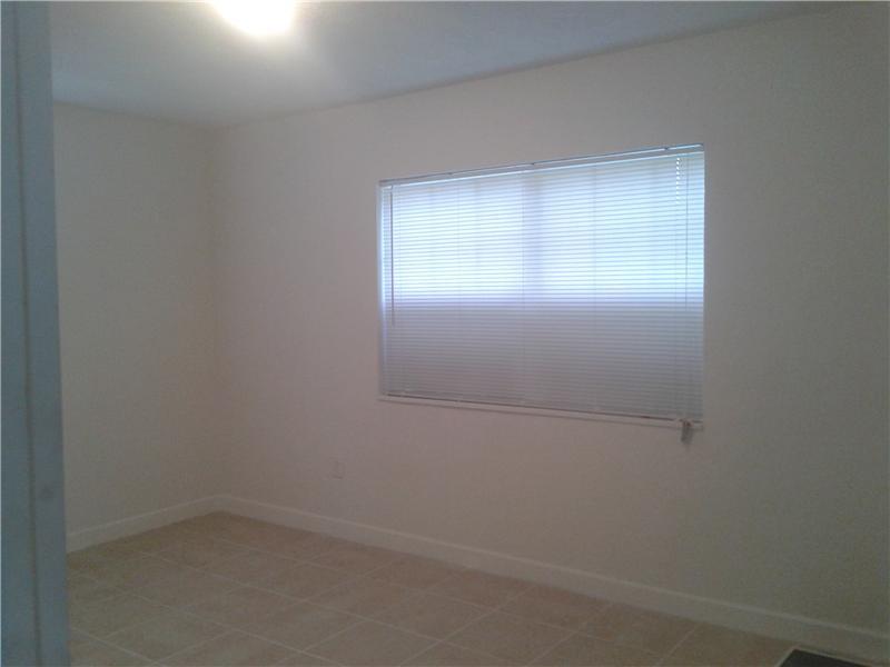 Freshly painted interior walls. Newly placed kitchen cabinets with easy to clean countertops.Updated bathroom fixtures. Beautiful tile floors thorughout the property. Great sized pool in the backyard . Will not last call right away!!