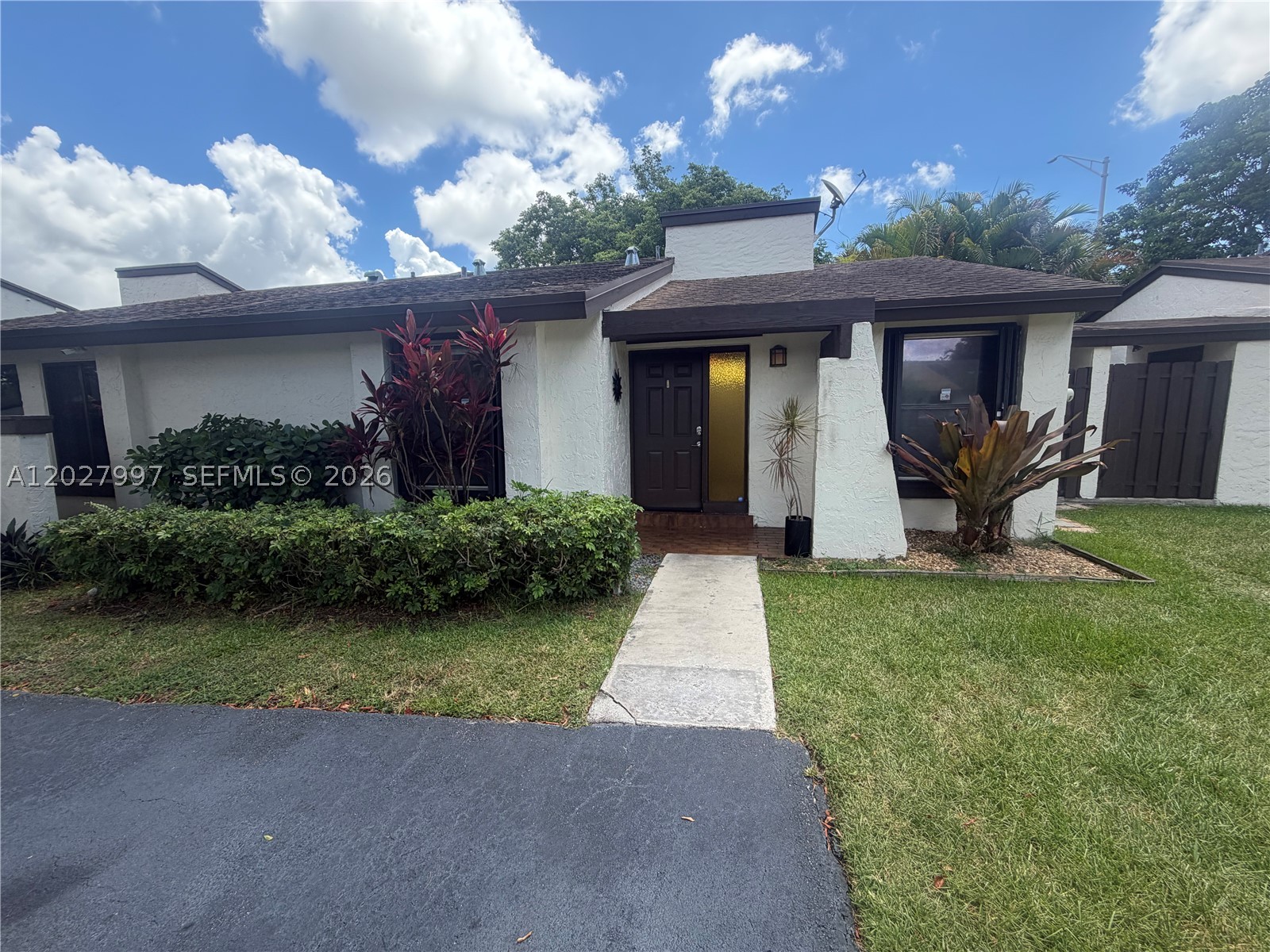Located in the quiet Woodgate community this is a lovely modern style 2/1 townhome with today's white and chrome touches integrated throughout the home. Updated kitchen with newer appliances, new flooring, washer/dryer. Gorgeous and in excellent condition . Intimate patio & yard in the back.