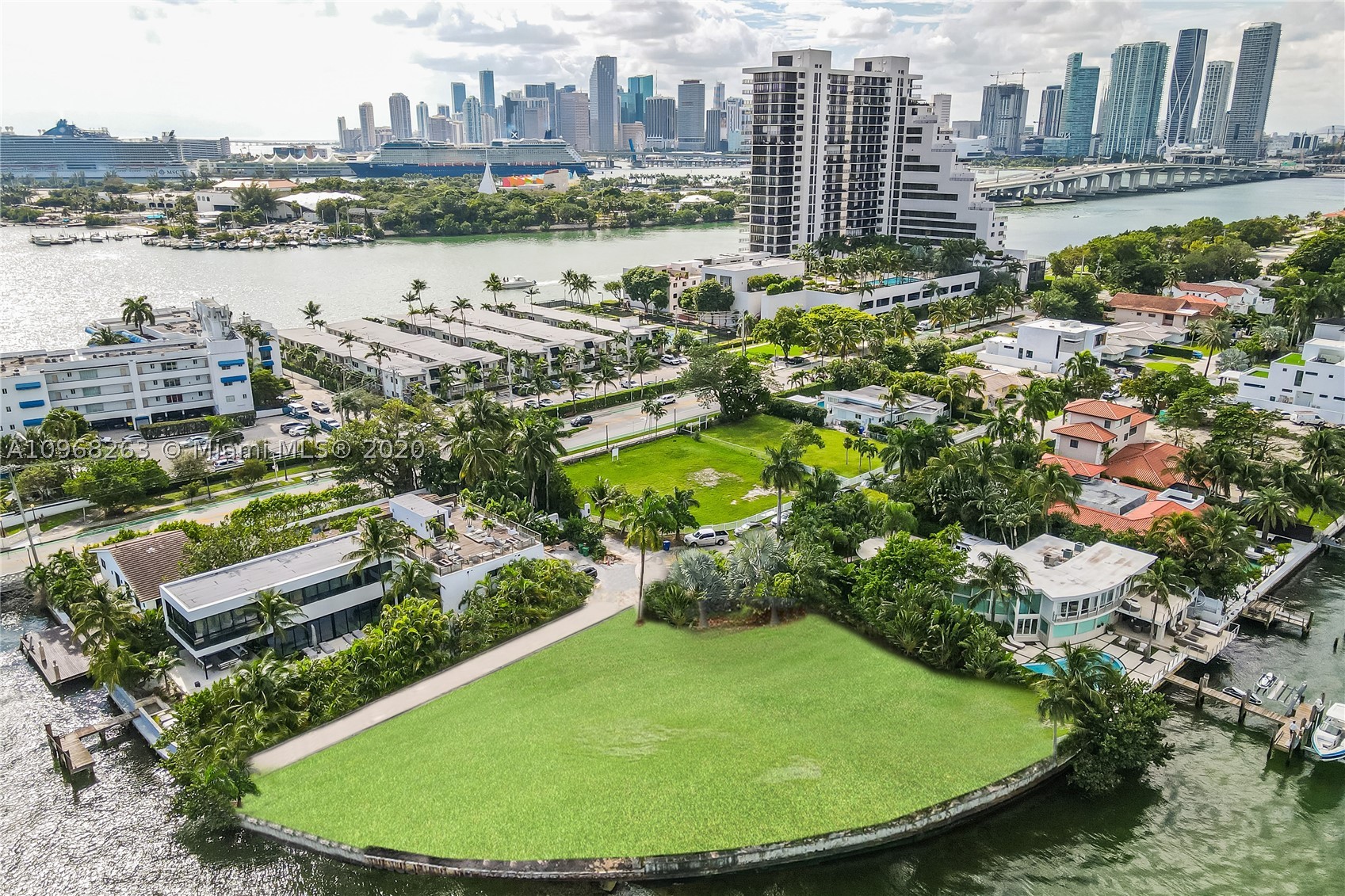 First time on the market in 20 years, this unassuming Oversized Double Plus Lot sits nestled at the end of a quiet street on the Venetian Islands. Once you enter this 24,000 sq ft Pie Shaped Property, you're in complete privacy, surrounded by a Mature Garden with a variety of beautiful trees and groundcover which then opens into endless views over Biscayne Bay. Over 250 feet of seawall gives you unobstructed views to South Beach and North Miami. The unique location of this land provides a completely private sanctuary in the middle of Miami Beach and just minutes from Downtown Miami, Wynwood and Brickell... Back at home you can escape all of the hustle and bustle of the City and feel like you are living in a secluded Caribbean Paradise