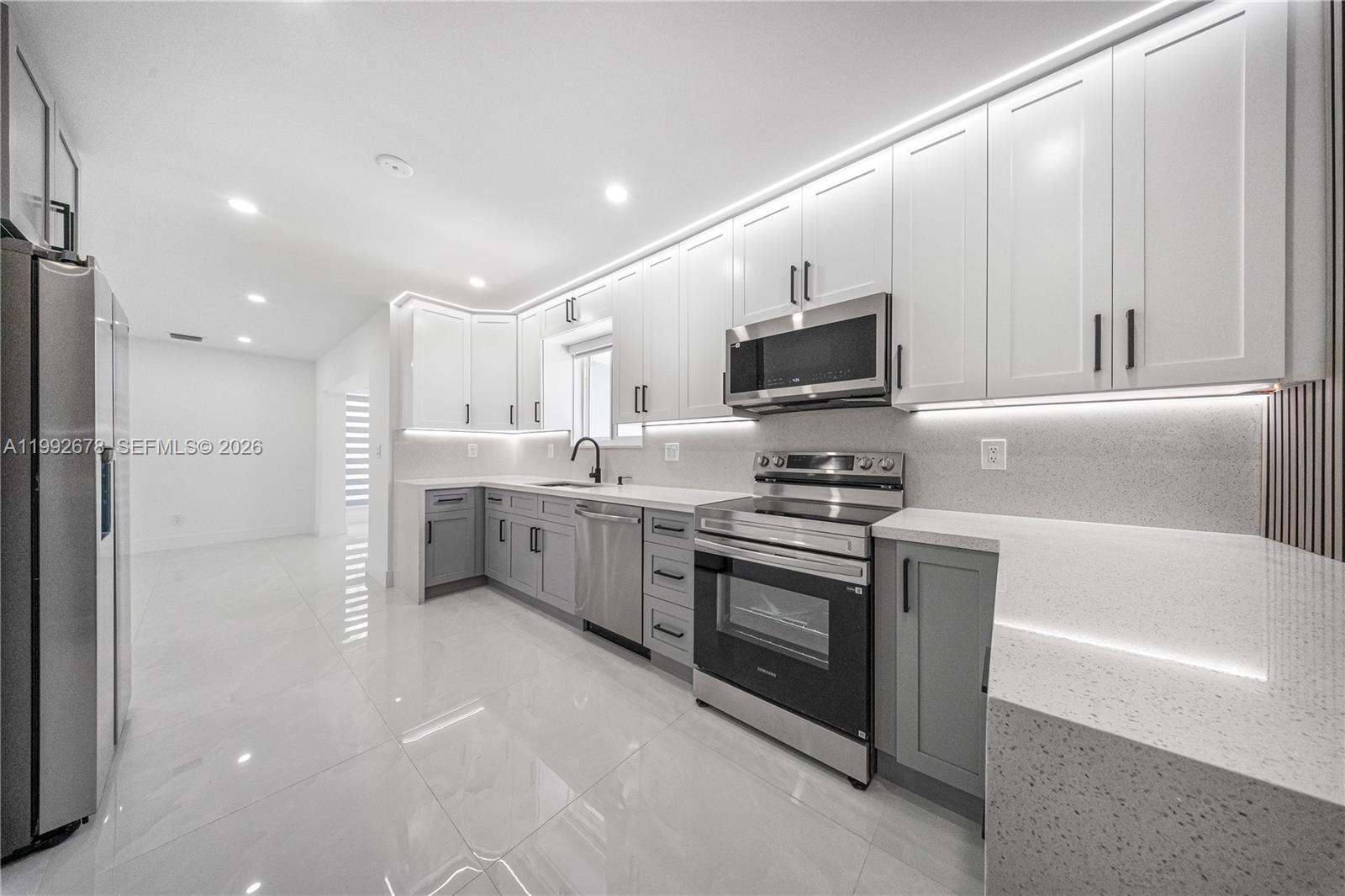 Completely remodeled house with 4 bedrooms and 3 bathrooms , a room with a bathroom that can be used as an income or in -law quaters. It has all new PVC plumbing, impact-resistant doors and windows, floors, bathrooms, and kitchen. You should see this property.