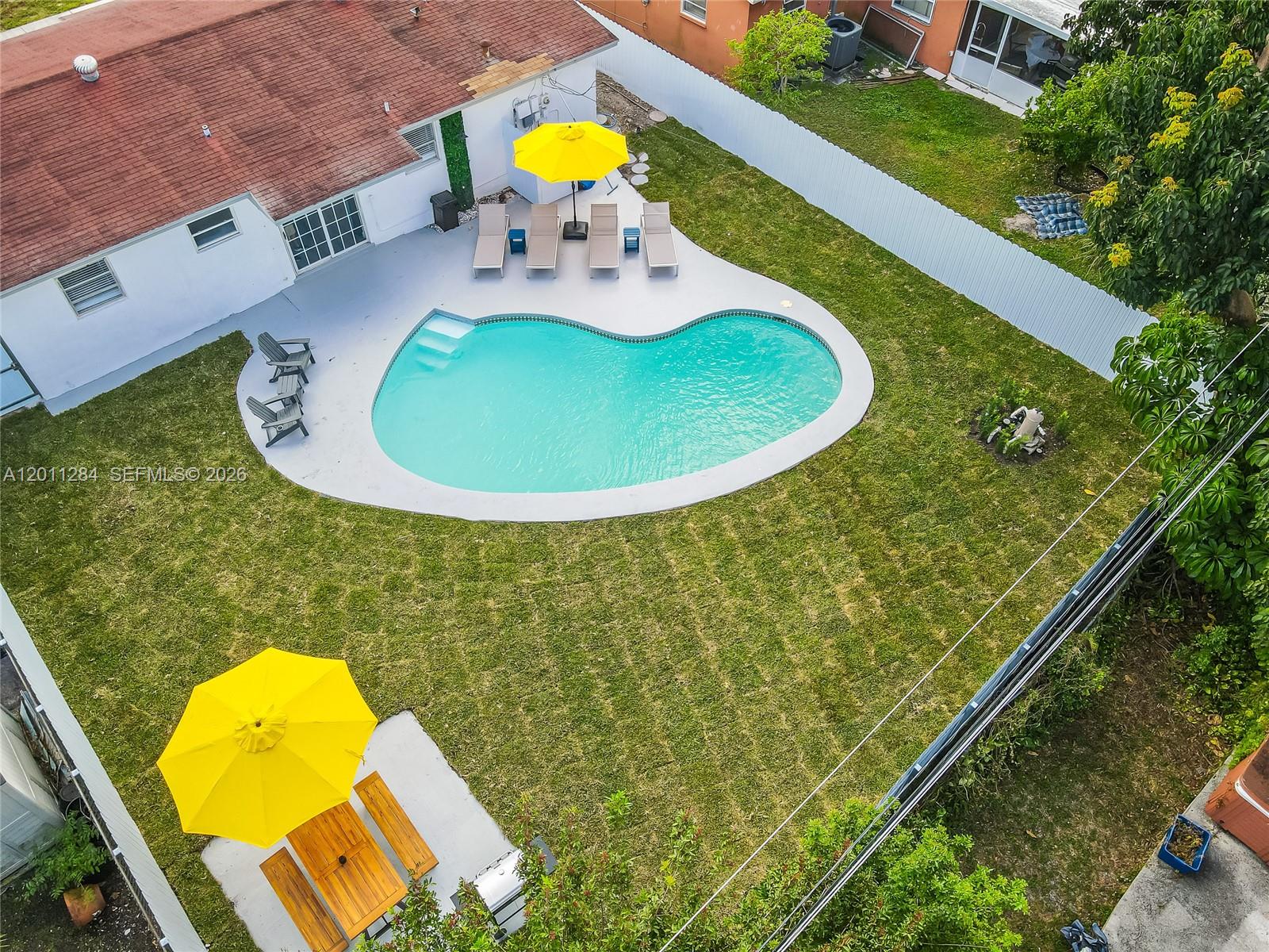 Welcome to this beautifully updated 3-bedroom, 2-bathroom home in the heart of Hollywood. Fully furnished and completely move-in ready, this residence features a modern kitchen with stainless steel appliances, sleek finishes, and a bright, open-concept layout designed for effortless living. Step outside to your own private backyard oasis, complete with a sparkling pool, lush landscaping, and a dedicated BBQ area—perfect for entertaining or unwinding year-round. Ideally located just minutes from the Seminole Hard Rock Hotel & Casino, as well as shopping, dining, and major attractions, with the beach only a short drive away. With no HOA, this property offers exceptional flexibility—making it not only a perfect primary residence, but also an outstanding Airbnb or short-term rental investment opportunity.