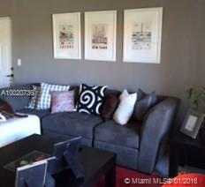 Large 2/2 model at gated Palm Gardens at Doral Condo.  Freshly painted, bright and spacious, tiled throughout with balcony, impact glass windows & sliding door, 9 foot ceilings , washer & dryer inside unit & 2 assigned parking spaces. Centrally located, close to highways, schools and shopping centers, community offers security, pool, gym & clubhouse.. NO PETS, Easy to Show with 24 hours advance notice. Available 2/15/2016.