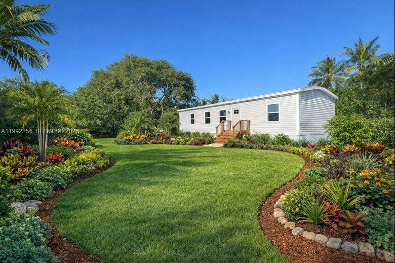 Opportunity to purchase for land value in Little Torch Key. Large lot with existing mobile home on site that is not habitable. Property is being marketed as land only. Lot is zoned IS (Improved Subdivision District), which typically allows for single-family residential construction subject to Monroe County Land Development Code and applicable ROGO requirements. Conveniently located less than 5 minutes from a public boat ramp. Buyer to verify zoning, building rights, and development potential with Monroe County. Do not enter structure. Sold AS-IS.