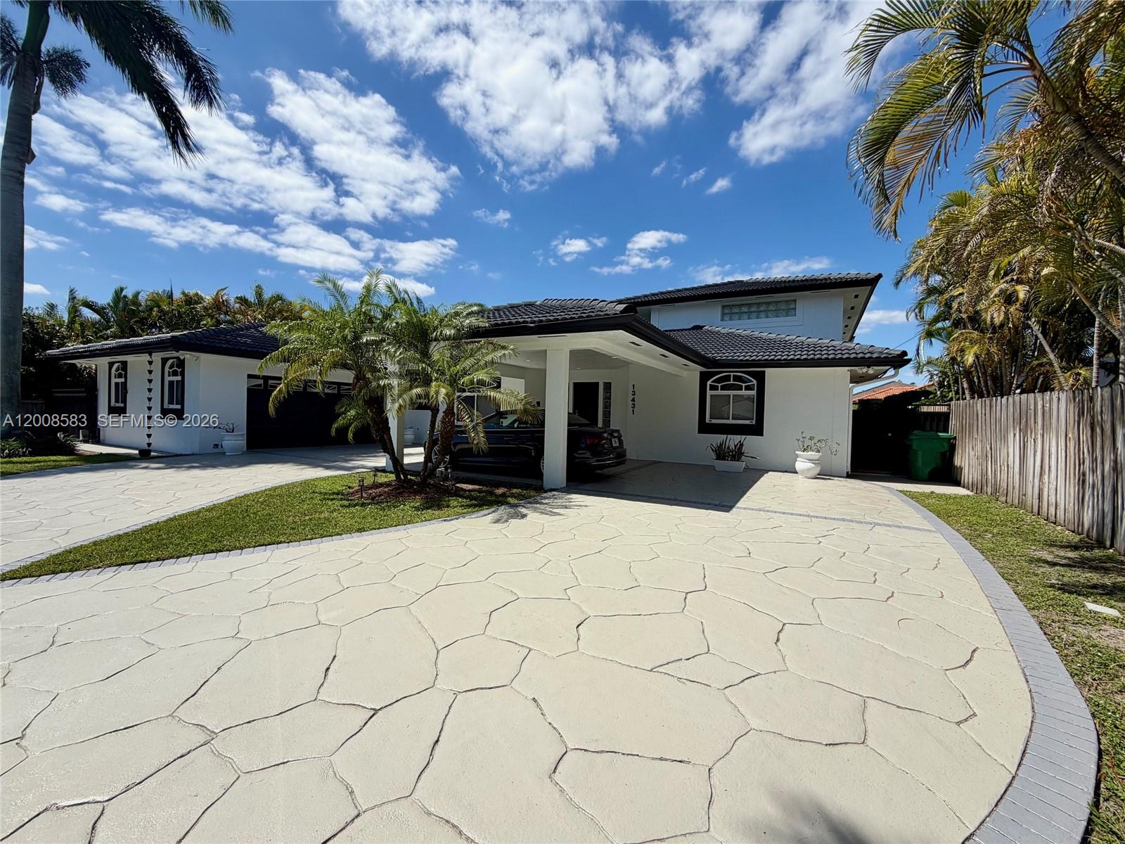 Here is your great opportunity to buy this incredible home and turn it into your dream home. This impressive residence offers a rare combination of space, functionality, and entertainment-focused design in one of South Florida’s desirable areas.
Set on a generous 13,997 sq ft lot, the home features 4,368 sq ft of living space with 5 bedrooms and 4 bathrooms, thoughtfully designed to provide both privacy and open living areas. A standout feature of the property is its exceptional parking and storage capacity, including a 2 car garage in the front of the home and an additional detached 2 car garage in the rear, connected with through doors along the left side of the house, for a total of 4 garage spaces. Inside, the home offers multiple distinct living and entertaining spaces, including a family room, a formal dining room, and a separate bar and dance floor room designed for hosting and entertainment. The layout includes a private master suite located on the second floor, creating a quiet and separated retreat from the main living areas. Outside, the property provides plenty of space to build a custom pool and pergola, offering excellent potential to create a resort style backyard. This home presents a rare opportunity in Miami with size, flexibility, and strong entertainment features throughout.  Call today as this will not last.