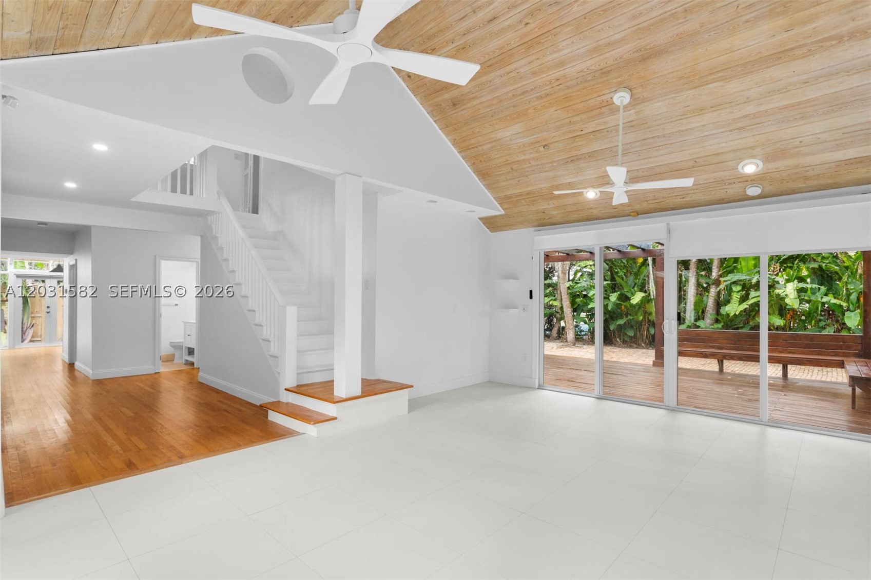 Nestled in the heart of Coconut Grove, this charming 4BD/3BA home offers privacy, character, and lush tropical surroundings. Features include impact windows and doors, real wood floors, vaulted ceilings, abundant natural light, and an updated kitchen and baths. Two upstairs loft-style rooms provide flexible space for a home office, playroom, guest room, or additional sleeping area. Enjoy a spacious outdoor deck and brick courtyard surrounded by mature landscaping. Conveniently located near Coconut Grove's top-rated schools, parks, marinas, and dining.