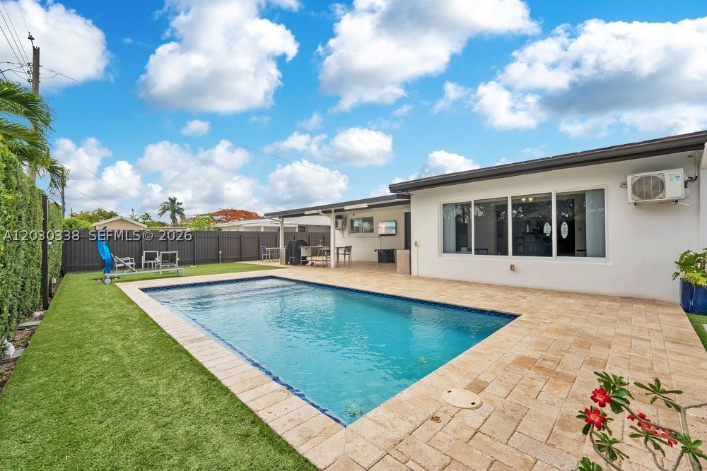 Stunning, fully remodeled single-family home in one of Miami's most convenient locations, just minutes from the Palmetto Expressway,  Tropical Park, and in an excellent school district. The home features 3 spacious bedrooms,  2 beautifully renovated bathrooms and a sparkling saltwater pool !  This move-in-ready residence offers new porcelain flooring, high impact windows and doors throughout.  It has an open floor plan filled with lots of  natural light.  Modern kitchen with quartz countertops & stainless steel appliances. A spacious family room with lovely views of the pool, backyard and large covered terrace surrounded by travertine pavers flooring.   There is ample side access on both sides of the property, with room for a boat or recreational vehicles with a new electronic gate.   It is a real pleasure to show.