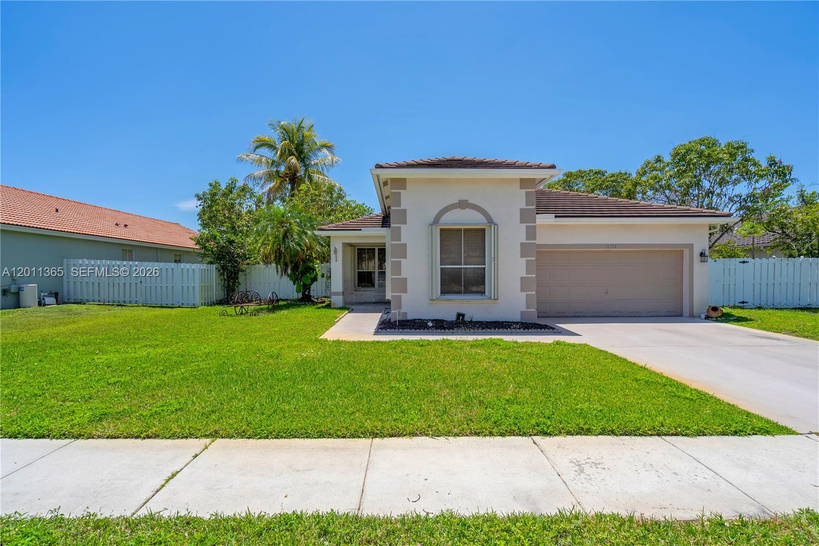 SELLER VERY MOTIVATED!!!!!  PRICE TO SALE****CHARMING ONE STORY 3 BEDROOMS, 2 BATHROOMS, 2 CARS GARAGE, LOCATED IN SOUGHT AFTER GATED AND GUARDED COMMUNITY PEMBROKE SHORES AT WEST PEMBROKE PINES, THIS HOUSE NEEDS A LITTLE TLC AND COSMETICS TOUCHES AND IS PERFECT FOR UPDATE AT BUYER'S TASTE,THE PRICE REFLECTS THIS*** ROOF IS FROM 2023 AND AC ONLY 3 YEARS, ALMOST NEW WASHER & DRYER ***ACCORDION SHUTTERS ALL AROUND THE HOUSE FOR INSURANCE CREDIT***FULLY FENCED BACKYARD WITH LOT OF FRUIT TREES (AVOCADO, MANGO, SOURSOP, TANGERINES, ETC) WITH A LARGE SCREEN ENCLOSED PORCH FOR GATHERING***TERRIFIC LOCATION CLOSE TO I-75, COSTCO, SHOPPING CENTERS, A+ SCHOOLS, RESTAURANTS, ETC.