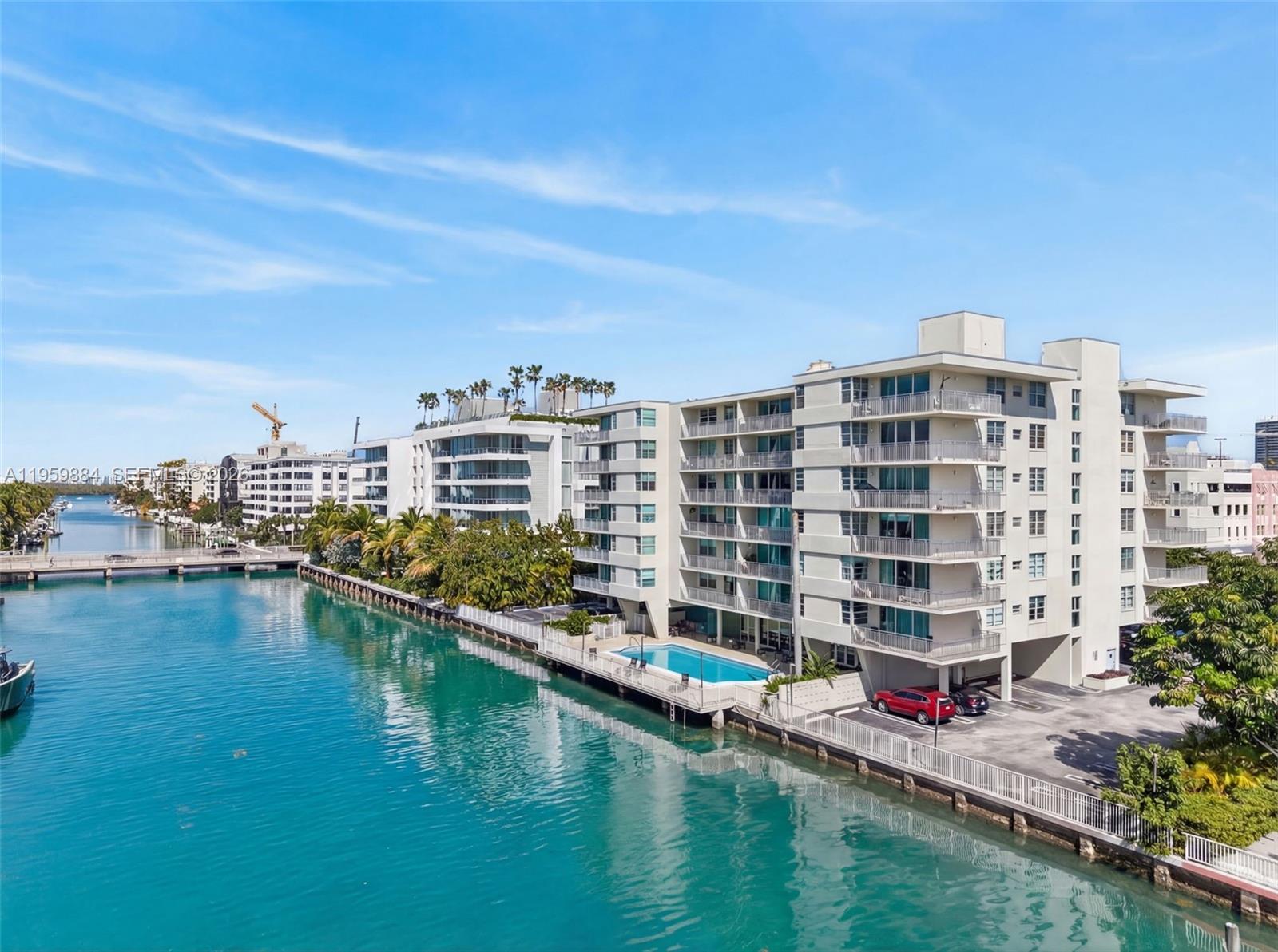 Welcome to refined island living in the heart of Bay Harbor Islands.
This elegant, renovated, boutique residence offers approximately 1,000 square feet of thoughtfully designed living space, combining comfort, style, and tranquility. Step into a bright, open-concept layout filled with natural light from its desirable eastern exposure and enhanced by sound-proof impact windows for peaceful everyday living. This corner hit faces NE where bay views can be seen from the balcony.

This desirable corner unit features a spacious primary bedroom, 1.5 bathrooms, extra den that can be used as an office or an extra room, and a well-appointed kitchen complete with dishwasher, microwave, electric range, refrigerator, and a generous pantry—perfect for both everyday cooking and entertaining.
Unwind on your private balcony while enjoying calming water and city views, ideal for morning coffee or evening relaxation.

Residents enjoy resort-style amenities including a bayfront swimming pool, social room, additional storage, and one assigned parking space. Perfectly situated directly across from Ruth K. Broad Bay Harbor K-8 Center, and within walking distance to dining, shopping, banks, and just minutes from the beaches, this home delivers the perfect blend of convenience and coastal lifestyle.

Rental rates $2,700-2,900 in the building.

A wonderful opportunity to own in one of Bay Harbor Islands’ most desirable boutique communities.