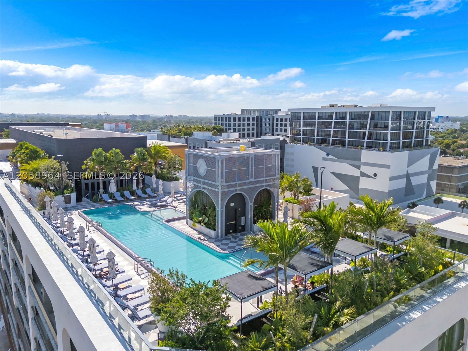 Discover elevated living + great investment at NoMad Residences Wynwood in this beautifully appointed 2 Br/2 Ba residence on the desirable southwest corner of the 4th floor. A high-demand Arts and Cultural destination. Vibrant city views and sunrise hues from your wrap-around balcony with a seating area. Thoughtfully designed with upscale furnishings, soaring 9+ foot ceilings, custom Italian cabinetry, premium Bosch appliances, and spacious walk-in
closets. Flexible ownership allows short-term rentals year-round with no blackout periods, offering excellent income potential. Rare daily rentals allowed, no minimum days! Easy management avail. Residents enjoy luxurious amenities, including a rooftop pool + cabanas, fitness center, concierge, co-working lounges, and acclaimed on-site Casa Tua Michelin star dining.