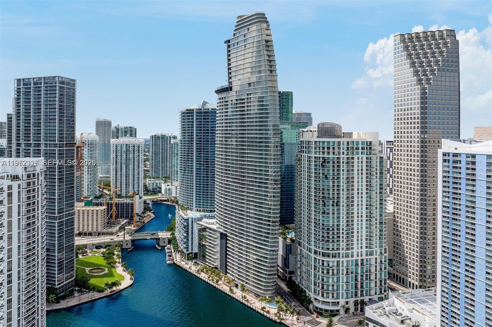 Discover luxury living, brand-new residence at the esteemed Aston Martin Residences Miami. This impressive 4-beds plus den features 5.5 baths exudes elegance and sophistication. Inspired by the iconic automotive brand, the design is modern and stylish, offering stunning views of Biscayne Bay and Miami Beach through expansive floor-to-ceiling windows and a balcony. Access to the Sky Amenities level, spanning 42,500 sq/ft of amenities, infinity pool, spa, private movie theater, state-of-the-art fitness center, virtual golf, art gallery, and dedicated kids’ and teens’ rooms. private elevator for added exclusivity. Inside, the home showcases superior craftsmanship with a gourmet kitchen featuring Gaggenau appliances, marble flooring, and abundant natural light streaming through large windows.