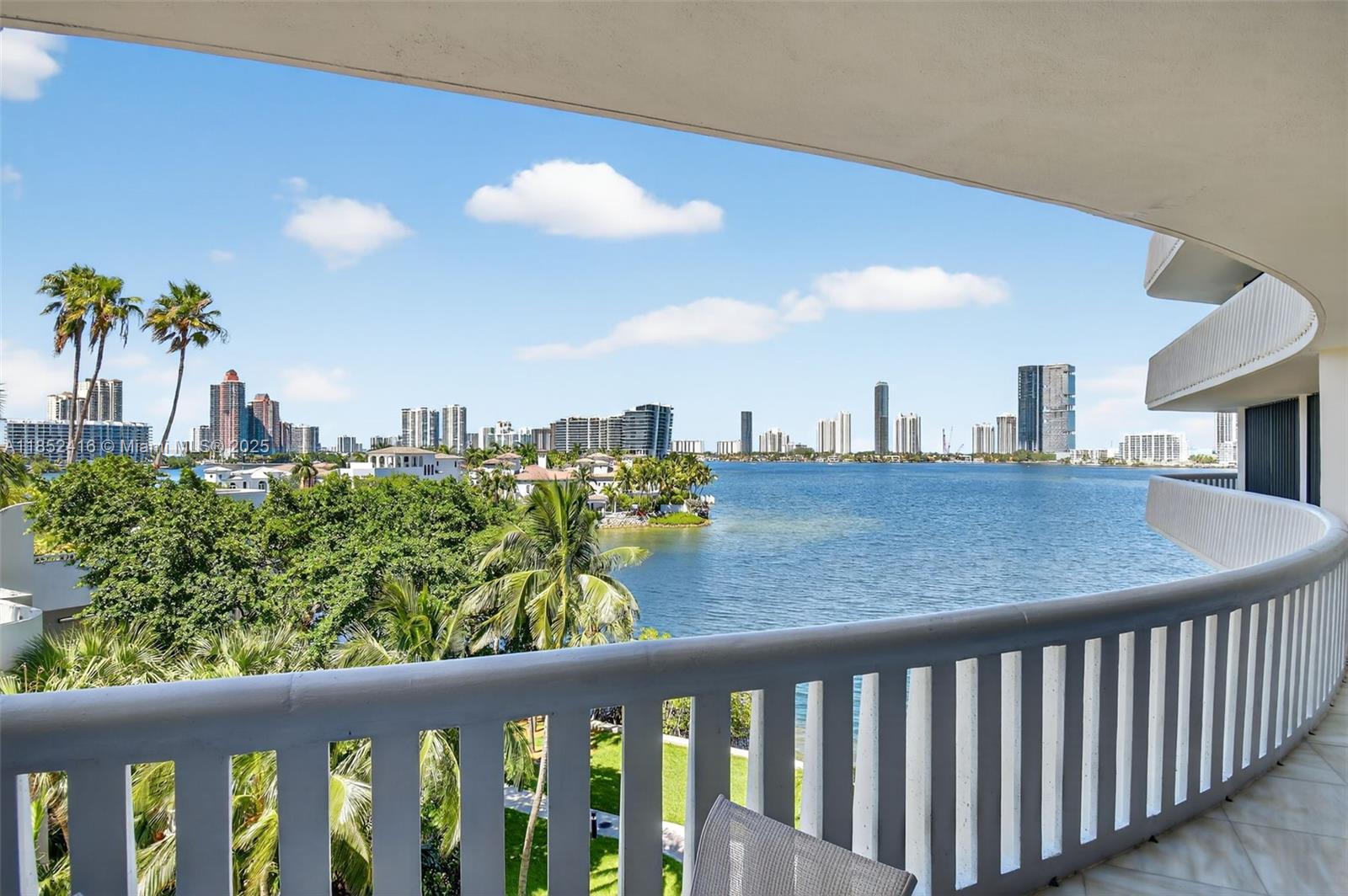 WOW! SPECTACULAR WATER VIEWS FROM EVERY ROOM! NEW KITCHEN WITH ALL NEW APPLIANCES. THIS PRISTINE LIGHT & BRIGHT COVETED SPLIT BEDROOM FLOOR PLAN WITH TILE FLOOR THROUGHOUT HAS A LARGE BALCONY OVERLOOKING THE WATER. CUSTOM CLOSETS, UTILITY ROOM W/WASHER/DRYER, & BRAND NEW AIR CONDITIONER. 
BUILDING HAS ALSO BEEN RENOVATED! THIS 84 ACRE ISLAND PARADISE OFFERS COUNTRY CLUB AMENITIES FEATURING A 27,000SF W/CLASSES, INDOOR SWIMMING POOL, 15 TENNIS COURTS & PICKLE BALL,3 RESTAURANTS, DELI, CHILDREN'S PLAYGROUND, ONSITE MARINA & MORE