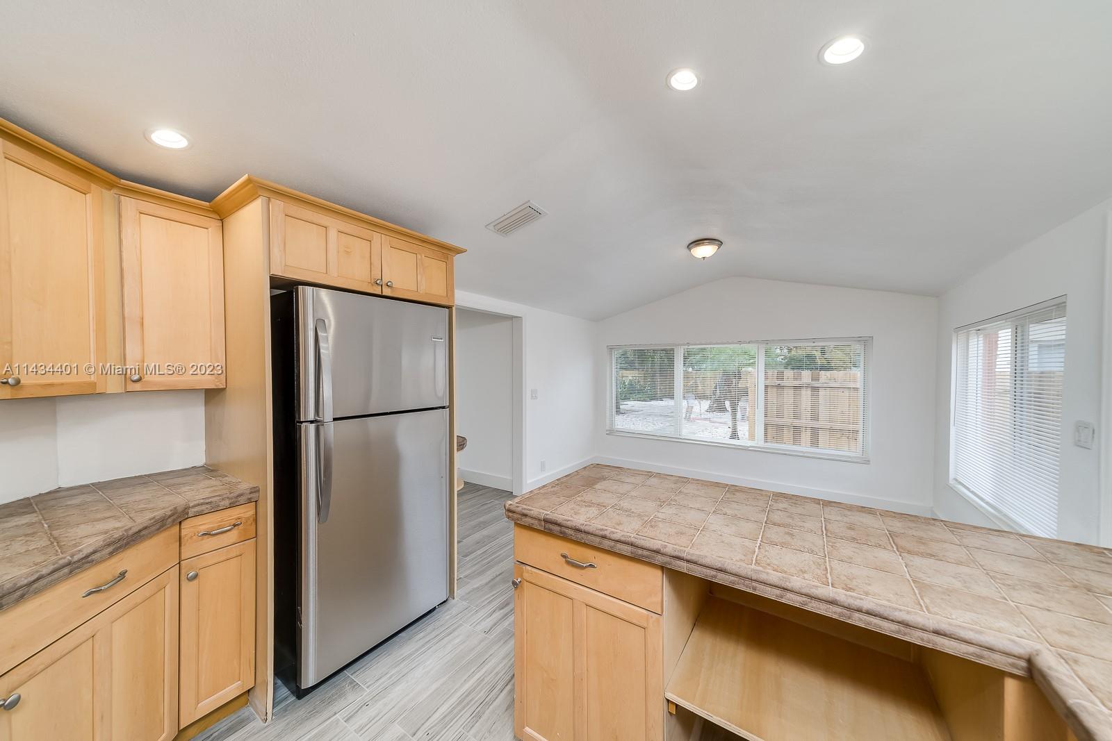 Beautiful gated modern house on huge 10,000sqft lot with gorgeous botanical garden common area that has generous fruit trees. Enjoy the simplicity of having electric and water included. Comes with stainless steel appliances, Central AC, and impact windows. Bring your bikes, kayaks, and paddle boards as your new home is less than 5 minutes from the beach and walking distance to Young Hollywood Circle.