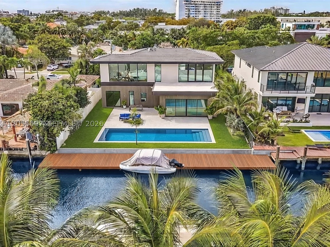 A striking 3,866 sq. ft contemporary waterfront estate in the prestigious gated community of Keystone Point. Featuring 70 feet of direct ocean-access waterfront, soaring 12-foot ceilings, and a seamless open-concept design, this home embodies sophisticated South Florida living. A new seawall and spectacular resort-style pool are currently under construction, completing an exceptional outdoor setting designed for waterfront entertaining. Ideally located just minutes from Bal Harbour Shops, pristine beaches, world-class dining, and both Miami and Fort Lauderdale airports.