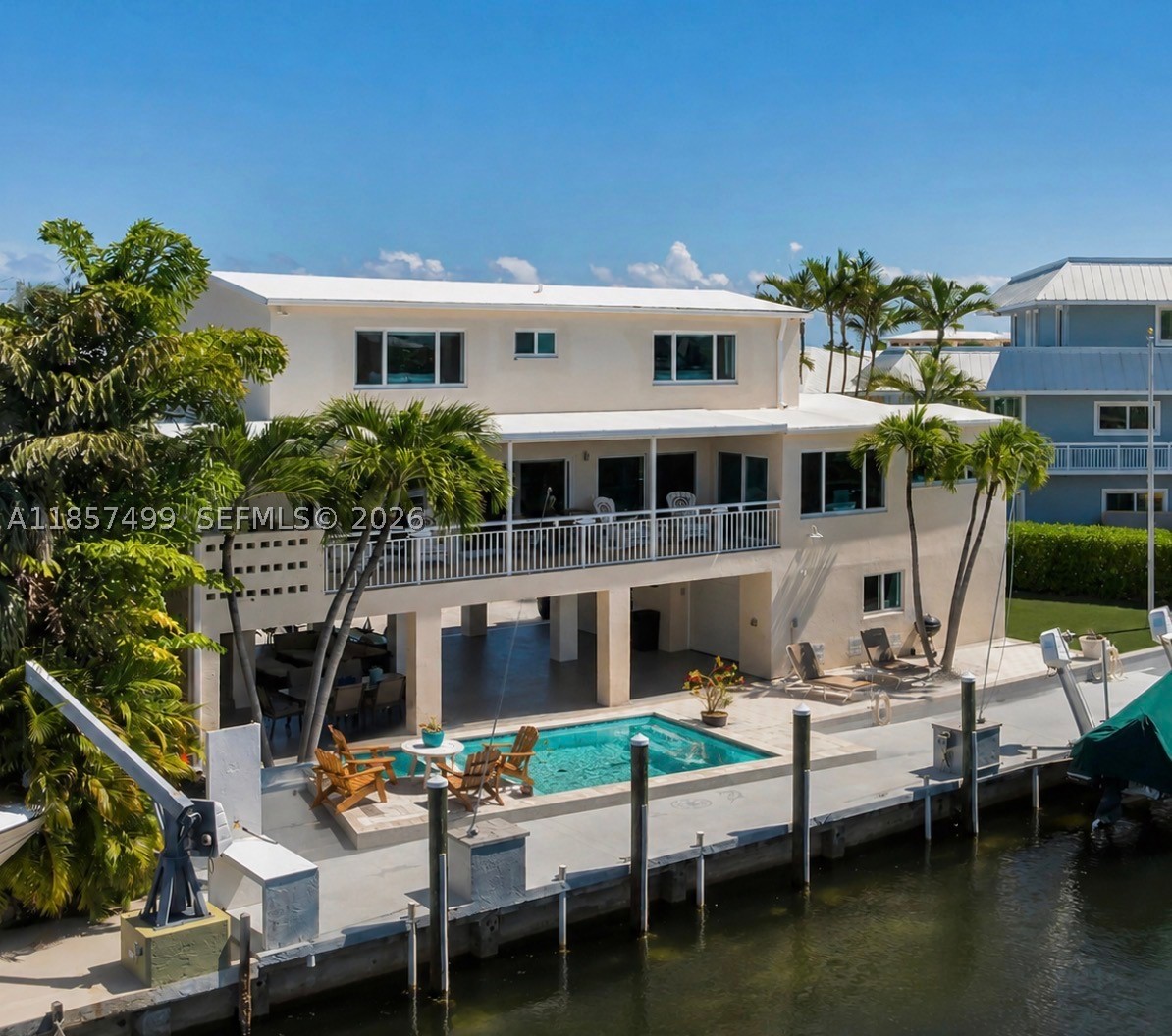 Rarely available, turnkey Deepwater Boater's Retreat with Private Beach Access in the Heart of Islamorada
Tucked away on a quiet cul-de-sac in one of the most desirable enclaves in Islamorada, this fully renovated 3-bedroom, 3.5-bath home delivers the ultimate Florida Keys lifestyle--where luxury, durability, and world-class boating converge.
Built for peace of mind and longevity, the home features solid concrete construction and a concrete roof, offering superior storm resilience and insurance advantages rarely found in the Keys.
Designed for serious boaters, the property boasts 90 feet of deep-water dockage with immediate access to both the bay and the Atlantic Ocean--no bridges.
Inside, the home is completely turnkey ready. Expansive balconies and a large outdoor patio overlook the wide canal, creating a private waterfront setting perfect for sunset dining.
The oversized paved driveway provides ample parking for guests, trailers, or multiple vehicles -- an uncommon convenience in this area.
What truly sets this property apart is access to a rare, highly coveted private beach area, widely regarded by locals as one of the finest in the Florida Keys, offering a unique blend of boating and beach lifestyle. 

Whether you're seeking a primary residence, a luxury second home, or an income-producing waterfront asset, this property delivers unmatched versatility and strong potential for high-end monthly rentals. Some Exterior Photos are AI-generated.