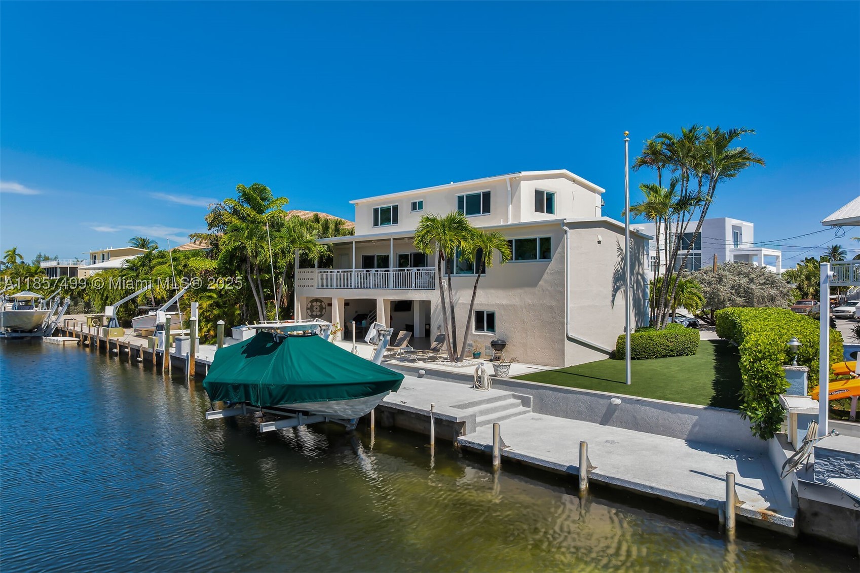 Rarely available, turnkey Deepwater Boater's Retreat with Private Beach Access in the Heart of Islamorada
Tucked away on a quiet cul-de-sac in one of the most desirable enclaves in Islamorada, this fully renovated 3-bedroom, 3.5-bath home delivers the ultimate Florida Keys lifestyle--where luxury, durability, and world-class boating converge.
Built for peace of mind and longevity, the home features solid concrete construction and a concrete roof, offering superior storm resilience and insurance advantages rarely found in the Keys.
Designed for serious boaters, the property boasts 90 feet of deep-water dockage with immediate access to both the bay and the Atlantic Ocean--no bridges.
Inside, the home is completely turnkey ready. Expansive balconies and a large outdoor patio overlook the wide canal, creating a private waterfront setting perfect for sunset dining.
The oversized paved driveway provides ample parking for guests, trailers, or multiple vehicles -- an uncommon convenience in this area.
What truly sets this property apart is access to a rare, highly coveted private beach area, widely regarded by locals as one of the finest in the Florida Keys, offering a unique blend of boating and beach lifestyle that is seldom available in a single property.
Whether you're seeking a primary residence, a luxury second home, or an income-producing waterfront asset, this property delivers unmatched versatility and strong potential for high-end monthly rentals.