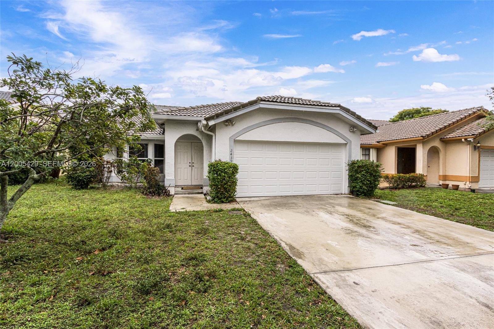 Seller's preferred lender is offering a free 1% rate buy down for the first year of your mortgage. Equire for more information. Looking for the right place to call home? Welcome to this stunning NON HOA residence nestled in the heart of Coral Springs! This property offers the perfect blend of comfort and convenience with it's 4 beds, 2 baths and porcelain tiled flooring throughout most of the home, no carpets! A/C is brand new 2026. Brand new 2026 kitchen. Gutters recently done. The garage is renovated. Hurricane protection for everything accept the front door and one window. (negotiable) There are spare & untouched tiles being left for the new owners. With its desirable location, spacious layout, and modern features, it presents an exceptional opportunity for those seeking an upscale living experience. Being a block from Royal Palm Blvd & two blocks from N University Dr you have everything, from Trader Joes, Starbucks, BJ's, Publix to new apartment buildings being built & a hospital - the options are limitless, come see it!