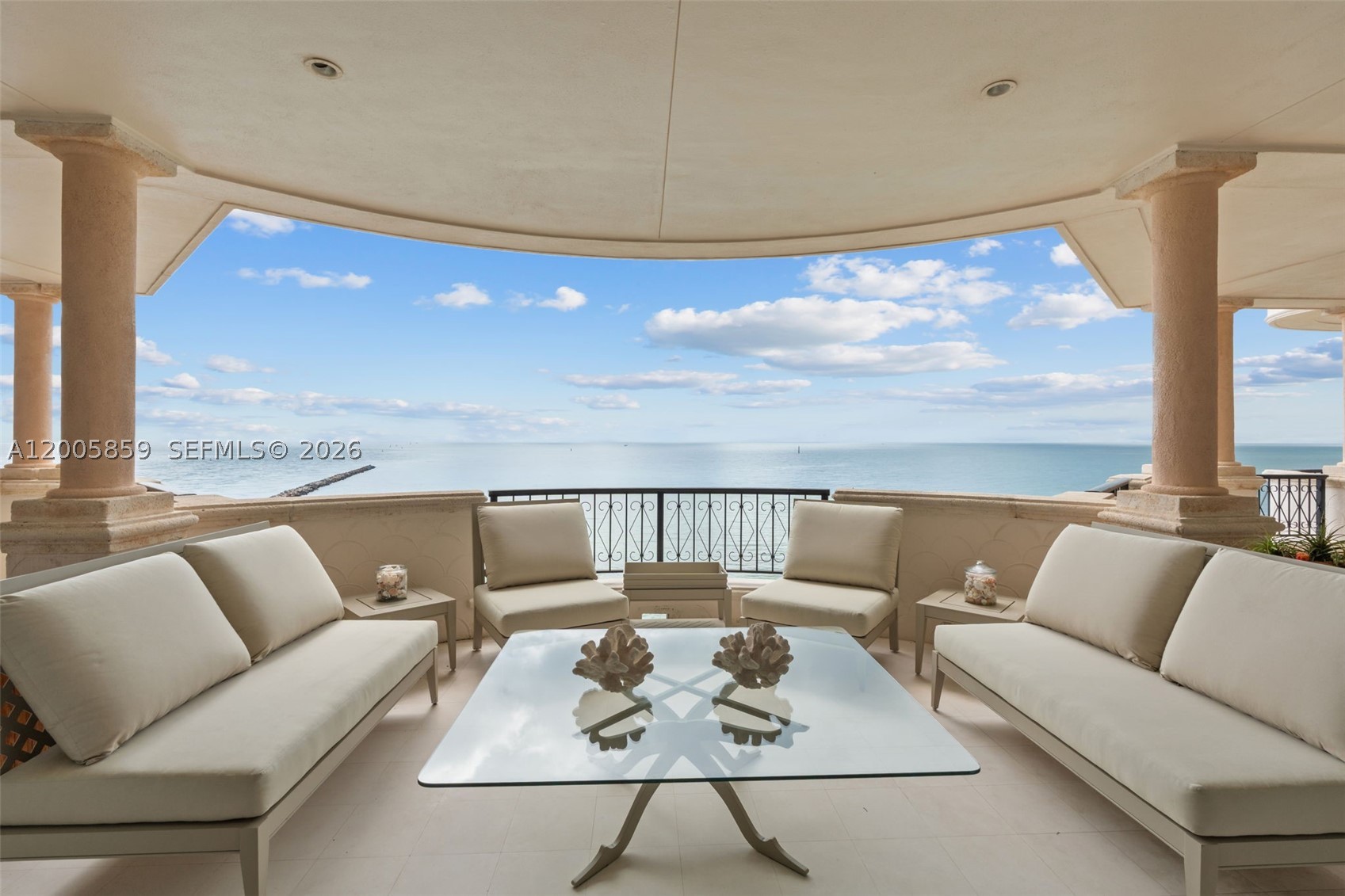 For the first time, this magnificent and much sought after Fisher Island residence is now available for sale. Featuring 6 bedrooms, 5 bathrooms floor plan. Spanning 7,304 square feet, this expansive interior is a masterclass in sophistication, created by a world-renowned interior designer. An additional 1,400 square feet of wrap terraces offers the perfect vantage point for sunrise and sunsets.  Situated on a high floor, double elevator entry. Residence offers a lifestyle of absolute privacy and architectural mastery. Custom Craftsmanship: Superb finishes and intricate custom millwork define this home and can be found throughout. limestone flooring • Chef’s Sanctuary: This home also boasts a custom-designed culinary kitchen equipped for high-level entertaining. •Safety: Recently upgraded with top-tier PGT hurricane-proof windows and doors (by Peet's) blending complete peace of mind with absolute aesthetic elegance. This home enjoys unobstructed, dual-exposure views that capture
the best of both worlds with views of the Atlantic Ocean and iconic Miami City Skyline.   3 assigned covered garage automobile parking spaces for 5 cars & access to EV charging,  with 2 golf cart parking spaces and a private climate-controlled storage room with cedar closet. Antique lightings excluded.
• The Ultimate Nautical Addition: For the yachting enthusiast, a 60-foot marina slip located
within the exclusive Fisher Island Marina is available for separate purchase