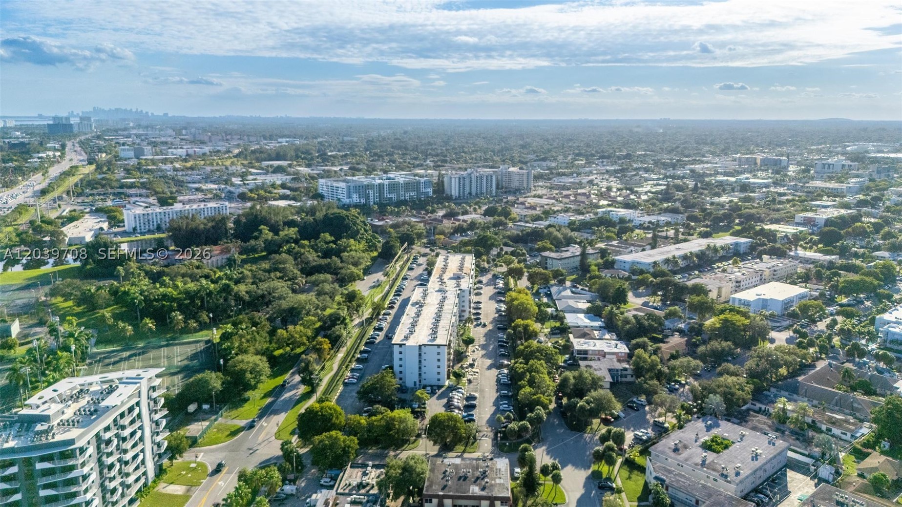Great opportunity to own or invest in desirable North Miami Beach. This 1-bedroom, 1-bath condo offers 720 sq. ft. of living space with plenty of potential to renovate and personalize. The unit features impact windows, an impact sliding door, and a screened balcony. WOODSIDE CONDOMINIUM is fully gated and offers a pool, clubhouse, elevator, and laundry room conveniently located on the same floor. Immediate rentals allowed (fee applies), making this an excellent option for investors with no waiting period. Ideally located just minutes from the beach, close to shopping, dining, public transportation, places of worship, and major highways. Directly across from the historic Ancient Spanish Monastery and the North Miami Beach Tennis Center.