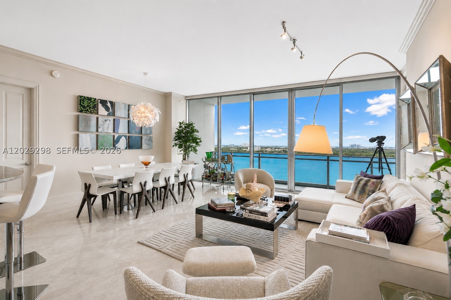 Elegant Remodeled 2BD/3 BA Residence at ONE BAL HARBOUR, attached to the RITZ-CARLTON HOTEL. High-end Decorator ready, featuring Direct Ocean & Intracoastal views, floor-to-ceiling windows and expansive terrace, marble floors throughout and elevator opens to your private foyer. Custom walk-in closets, extra lighting, and a gourmet kitchen with Sub-Zero & Wolf appliances. Full access to RITZ-CARLTON HOTEL's world-class amenities: Ocean & poolside service, an on-site restaurant, pool bar, spa, fitness center, 2 beachfront pools, business center, and 24-hour concierge and valet. DIRECT BEACH ACCESS, a jogging path, minutes from Haulover Marina, and walking distance to the iconic BAL HARBOUR SHOPS and South Florida's finest dining. 1 assigned parking, valet parking. 1 storage.