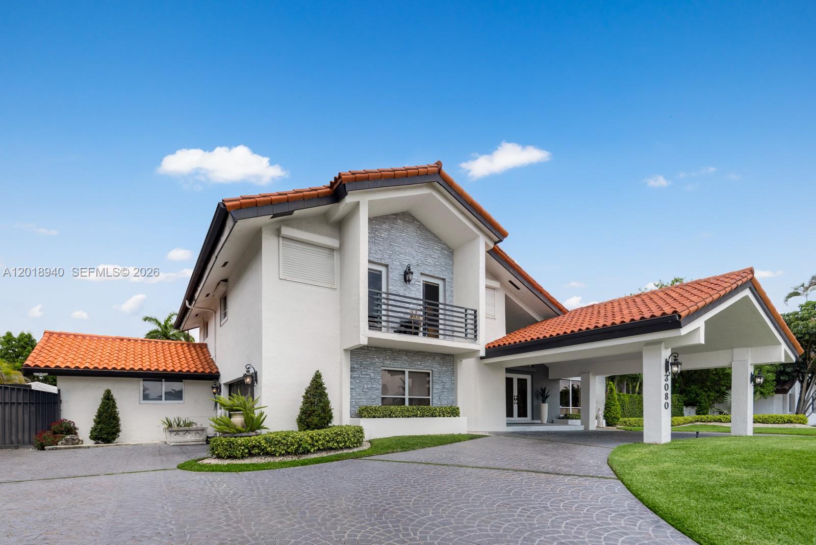 This spectacular standalone single-family residence situated on an oversized 16,000 sq ft lot with NO HOA. Offering unmatched freedom and flexibility, this property features abundant parking and ample space for your large boat, RV, trailers, or recreational toys. Inside, the home showcases stunning wood-clad volume ceilings that create warmth, character, and architectural charm throughout. The main living areas have been beautifully updated and maintained, blending modern comfort with timeless style. Expansive windows flood the home with natural light, creating bright and inviting spaces from every angle. The oversized kitchen is a dream for any home chef, complete with a large center island, generous prep space, and an ideal layout for entertaining family and guests alike. Upstairs, you have 3 spacious bedrooms, 2 balcony's and a loft that offers the perfect setting for a home office, creative studio, or flexible workspace. Step outside to your own paradise. Designed for entertaining, the backyard features a full outdoor kitchen, covered terrace for dining, charming tiki hut, and pergola with multiple areas to gather and relax. The large pool enjoys full sun exposure, making it the perfect place to lounge, tan, and enjoy South Florida living year-round. Even with all the entertainment features, there is still plenty of usable green space for kids and pets to play freely. Converted Garage. Conveniently located near the Turnpike, providing easy & quick access throughout Miami.