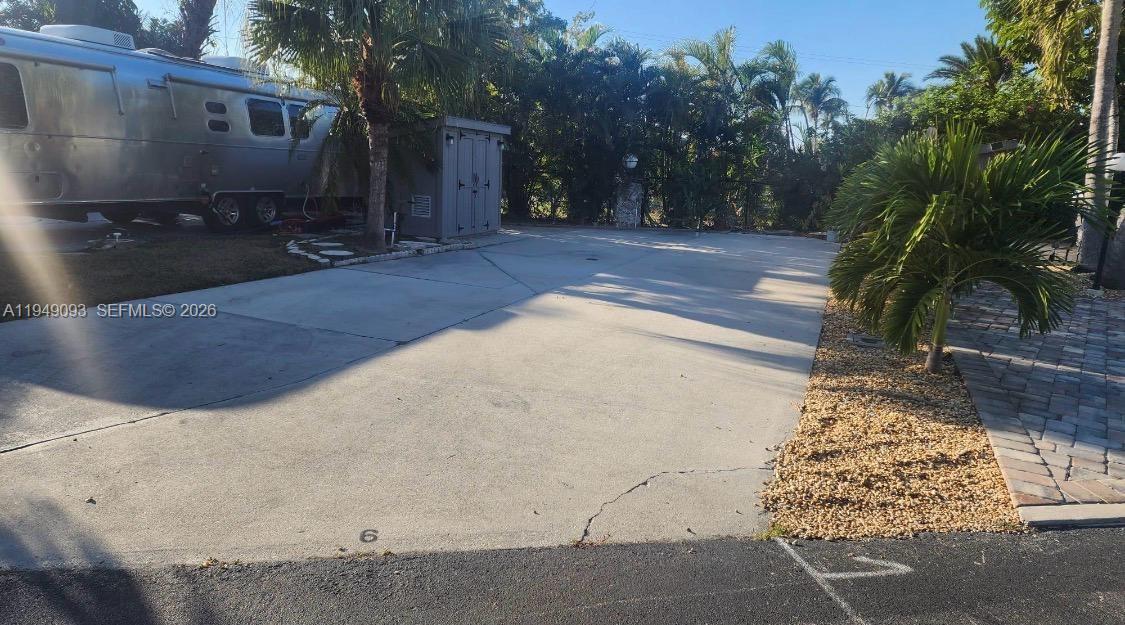 RV lot located in a gated island community in Chokoloskee, offering a peaceful retreat surrounded by natural beauty. This well-maintained lot features a cement pad with full hookups and access to resort-style amenities, including multiple swimming pools, hot tubs, fitness center, clubhouse, laundry facilities, tennis and pickleball courts, shuffleboard, and boat ramp access. Cable and Wi-Fi are included through the association. Conveniently located near Everglades City and world-class fishing, this property is ideal for RV owners seeking a low-maintenance getaway in a unique coastal setting.For showings or qustions,please contact listing agent directly