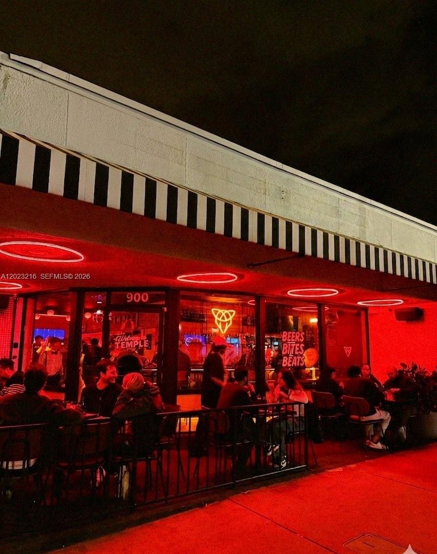 Rare opportunity to acquire a second-generation restaurant/bar space in the heart of Miami Beach's residential corridor on Alton Road. This highly visible corner location offers what few South Beach properties can — dedicated on-site parking, an invaluable amenity that sets this space apart from the competition. The build-out features a well-appointed interior along with a charming outdoor seating area, ideal for alfresco dining or a vibrant bar scene. Currently operating as a successful late-night bar with a proven track record. Key money $80k.