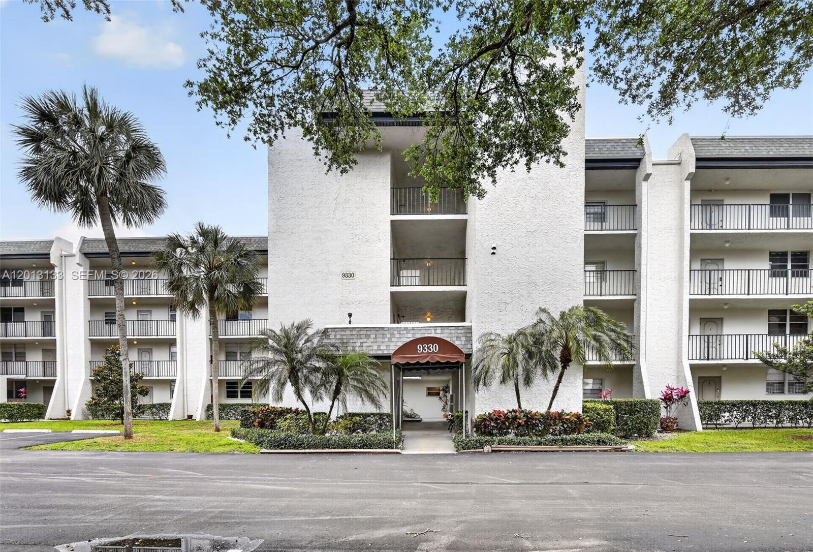 Welcome to Pine Island Ridge, a highly sought-after private country club community in the heart of Davie. This spacious 2BR/2BA third-floor waterfront condo features tile flooring throughout, SS appliances, impact glass, and large rooms with tons of storage. Enjoy amazing water & pool area views from your private enclosed Florida room, an ideal extension of your living space. Secure lobby entrance and elevator building. All-ages community with resort-style amenities including golf, heated pool, pickleball, tennis, fitness center, clubhouse, BBQ/picnic area, and playground. Small pets welcome. No leasing or corporate ownership permitted. Prime location near shopping, dining, and major highways. Assessments up to date.