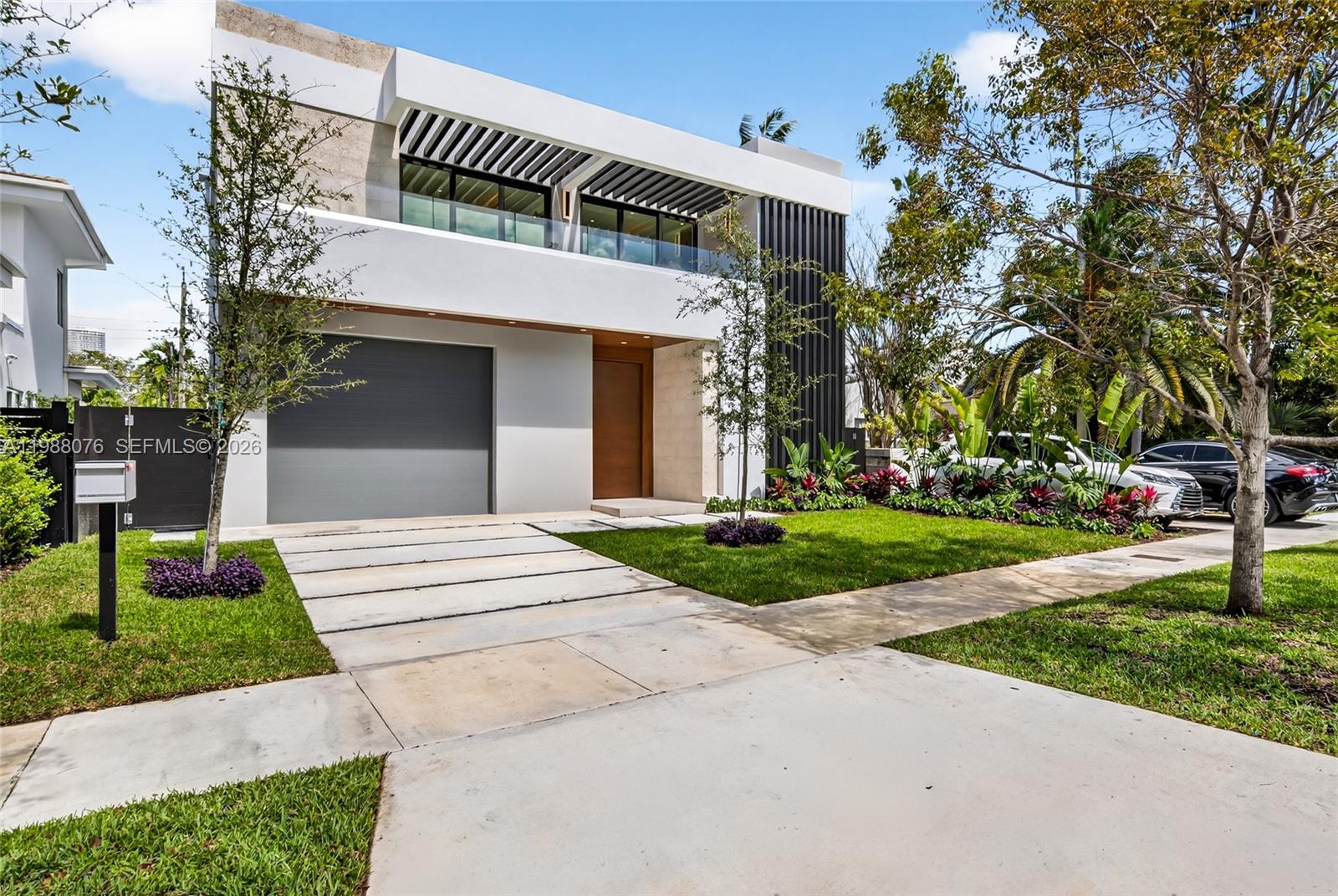 Welcome to Villa Verano, a newly completed (2026) ultra-modern architectural masterpiece offering 5,772 total square feet of construction, featuring 4 spacious bedrooms, a dedicated office, walk-in pantry, two expansive terraces, and a spectacular primary suite. The home also includes a swimming pool, dry sauna, and a spacious garage, combining luxury with functionality.Upon entry, a dramatic pivot door opens to soaring high ceilings and a completely open, column-free floor plan, creating a seamless and unobstructed flow. Floor-to-ceiling glass doors retract into the walls, effortlessly blending indoor and outdoor living, and leading to a fully equipped gourmet outdoor kitchen, ideal for entertaining. Featuring a full concrete roof and enhanced structural reinforcement, fully wired for high-speed internet and security cameras. Ideally located just 0.5 miles from I-95 and approximately 1 mile from Brickell and the future Citadel headquarters, this property offers unmatched access to one of the fastest-growing financial hubs.