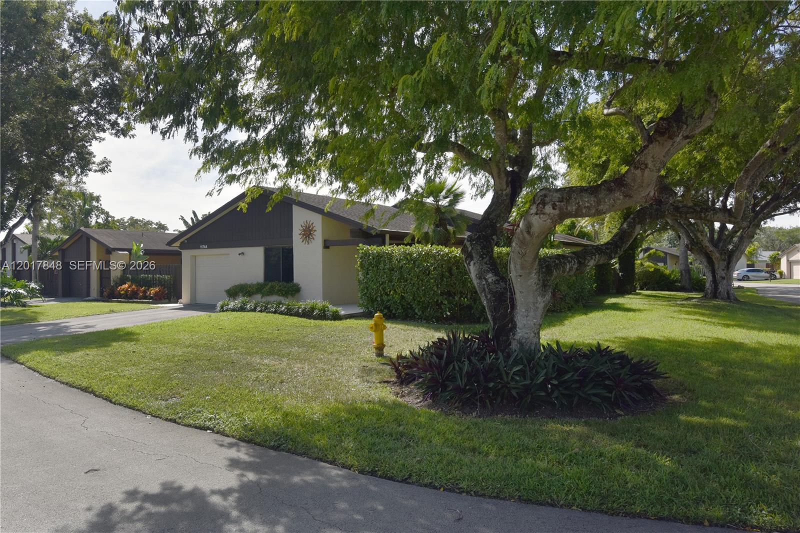 Beautiful corner home in The Crossings! This turn-key residence features white porcelain floors, updated bathrooms, spacious living areas, and an oversized family room perfect for everyday living and entertaining. The kitchen offers granite countertops, stainless steel appliances, and plenty of cabinet space, while the primary suite includes his and hers closets. Additional upgrades include impact windows and doors, plantation shutters, epoxy garage flooring, a tankless water heater, and security systems throughout. Enjoy a huge backyard patio with room for a pool and gazebo. Located near top schools, shopping, dining, and easy Turnpike access.