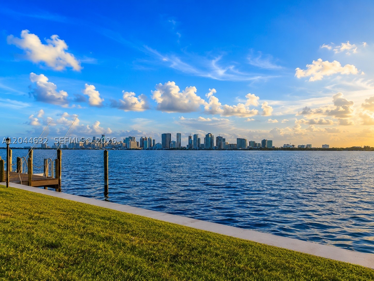 The only double waterfront lot currently available in North Bay Village, this extraordinary trophy property presents a once-in-a-generation opportunity to create a world-class waterfront estate. Spanning an impressive 17,966 SF with 128 feet of direct open bay frontage, this exceptional parcel captures unobstructed panoramic views of Biscayne Bay and the iconic Downtown Miami skyline. Positioned just one property from the point, the setting offers breathtaking sunrise and sunset vistas, sparkling city lights, and expansive open water views that are simply unmatched. Whether you're a developer, investor, or discerning end user, this is an unparalleled opportunity to build a signature luxury residence on one of the largest and most desirable waterfront lots in the area. The existing 3,317 SF residence with 3 bedrooms, 2 bathrooms + 2 powder rooms provides the option to enjoy the property immediately while designing your architectural masterpiece. Ideally located just minutes from Miami Beach, Bal Harbour, the Design District, Wynwood, Brickell, Downtown Miami, and Miami International Airport, this is a rare opportunity to acquire one of Miami's most coveted waterfront development sites.