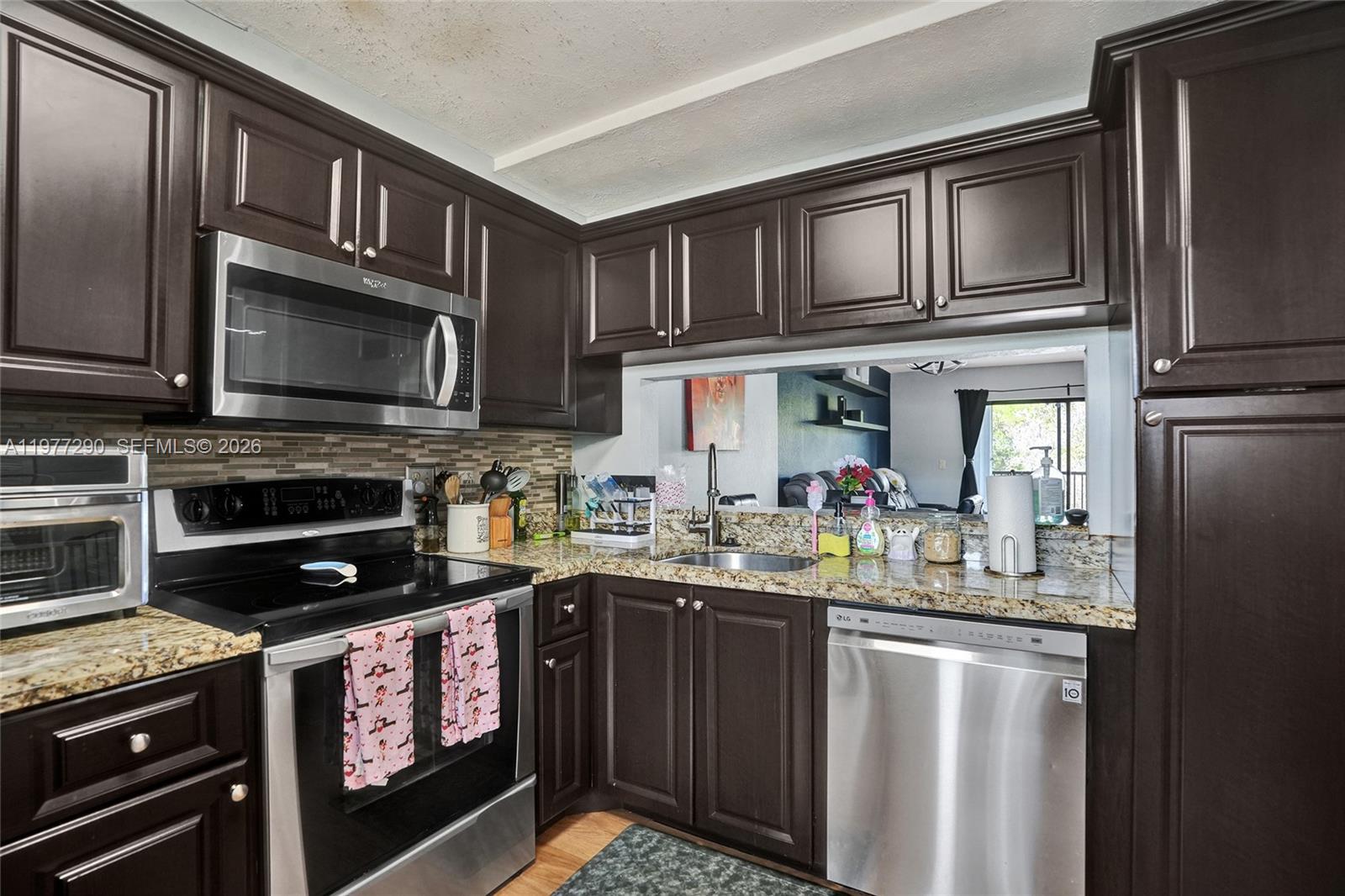Discover your perfect oasis! This spacious, move-in-ready condo offers over 1000 sq ft of comfortable living, featuring 2 generous bedrooms and 2 full bathrooms. Step inside to find modern conveniences, including a tankless water heater and an in-unit washer and dryer for ultimate ease. Peace of mind is provided by the newer A/C unit (2016). The living area extends seamlessly to an oversized screened balcony, perfect for enjoying your morning coffee or evening breeze. Residents of this community enjoy exceptional amenities, including a stunning lakefront pool and a well-appointed clubhouse. Experience convenience and comfort in a fantastic location. Don't miss this opportunity!