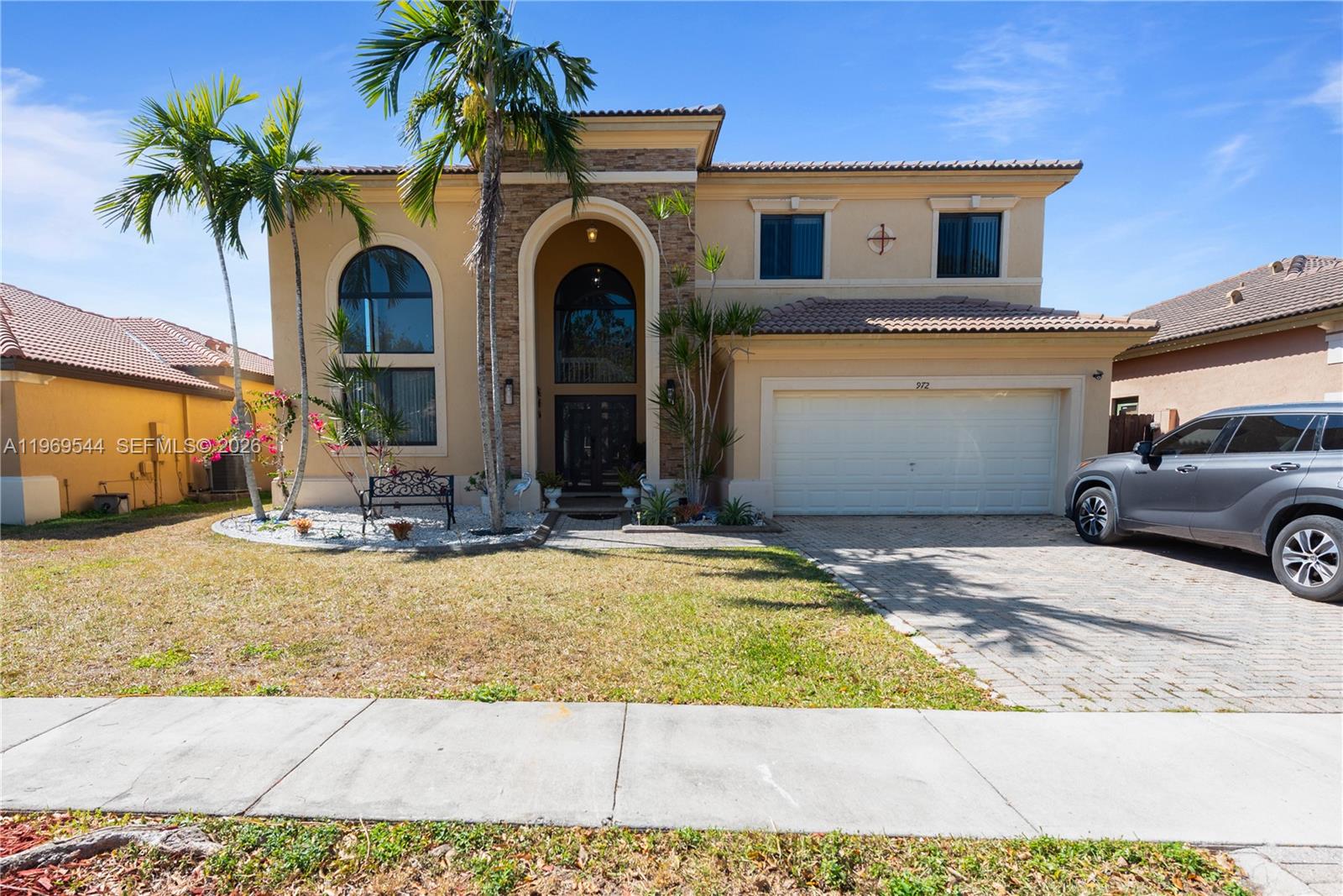 Welcome to Estates at Mendicino in Homestead! This spacious 4BR/3.5BA two-story home blends comfort, style, and valuable upgrades. BRAND NEW IMPACT WINDOWS! A grand double-door entry opens to elegant tile flooring, soaring vaulted ceilings, and a bright open-concept layout ideal for everyday living and entertaining. The kitchen features white cabinetry, stainless steel appliances, pantry storage, and stunning Calacatta quartz countertops, plus an eat-in counter and breakfast nook that flow seamlessly into the main living areas. The large family room offers wide doors leading to the backyard, creating effortless indoor-outdoor living. Enjoy a spacious yard with mature fruit trees—some already producing—for your own private retreat. Upstairs, laminate flooring runs throughout. The generous primary suite includes a walk-in closet and spa-style bath with dual sinks, soaking tub, and separate shower. A private mini-suite with full bath and walk-in closet is perfect for guests or multigenerational living. Additional features include upstairs laundry, ample storage, and a 2-car garage with EV charging capability. Impact windows and doors provide full hurricane protection, improved energy efficiency, and potential insurance savings. Gated community with 24-hour security, clubhouse, gym, and pool. Minutes to hospitals, shopping, dining, Florida Turnpike, and US-1. PROOF OF FUNDS AND/OR PRE-APPROVAL LETTER REQUIRED PRIOR TO SCHEDULING A SHOWING OF THE PROPERTY.