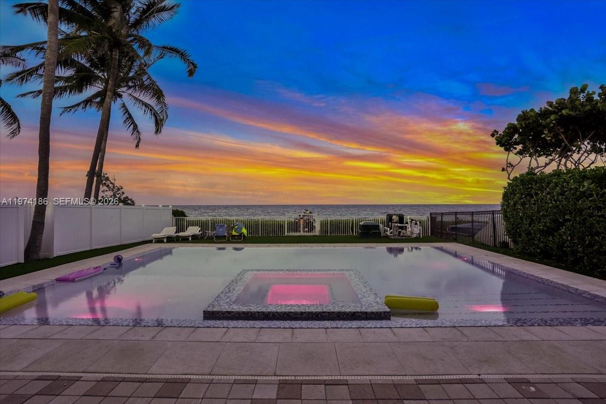 Experience rare direct oceanfront living in one of only 40 homes located directly on the sand in Fort Lauderdale Beach. This exceptional residence offers over 5,000 square feet under air with breathtaking ocean views from the expansive great room, open-concept kitchen, and oversized beachfront terrace. Designed for both luxury and comfort, the home features 5 spacious en-suite bedrooms, a guest bath on the main level, and a cabana bath with shower. Enjoy resort-style outdoor living with a stunning pool just steps from the beach. Turn-key and move-in ready. Shown by appointment only for pre-qualified buyers with proof of funds. A truly unique opportunity to own one of South Florida’s most exclusive beachfront homes.