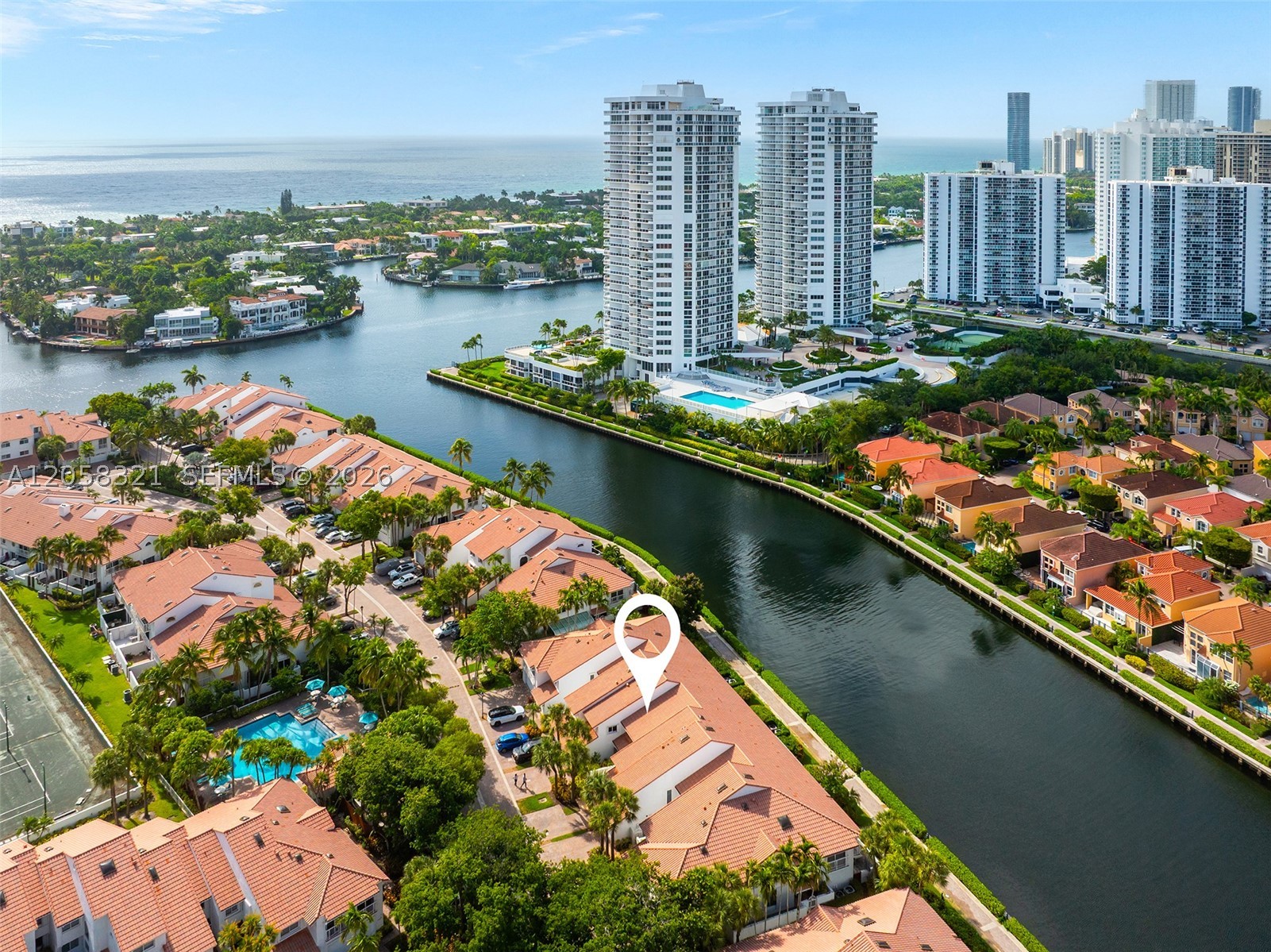 Golden Pointe rarely available Model D waterfront townhome offering stunning water views in Golden Pointe’s exclusive gated community. This model D residence features a wider floor plan with a full bathroom on the first floor. This 3BR/3BA + Den townhome has an updated contemporary kitchen and is filled with natural light and boasts a one-car garage.  Primary suite with private balcony overlooking the water.  Entertain in your waterfront terrace with southern exposure ensuring abundance of natural sunlight year-round, direct access to the scenic waterfront promenade leading to The Waterways Marina and boat slips.  Walking distance to Aventura Mall, Shoppes of the Waterways, top schools, and more. Golden Pointe residents have the option to join the Resident Club & Spa for an annual membership fee, offering access to premium resort-style amenities.  Community of only 79 residences, with approx. only half on the water, don’t miss this opportunity!