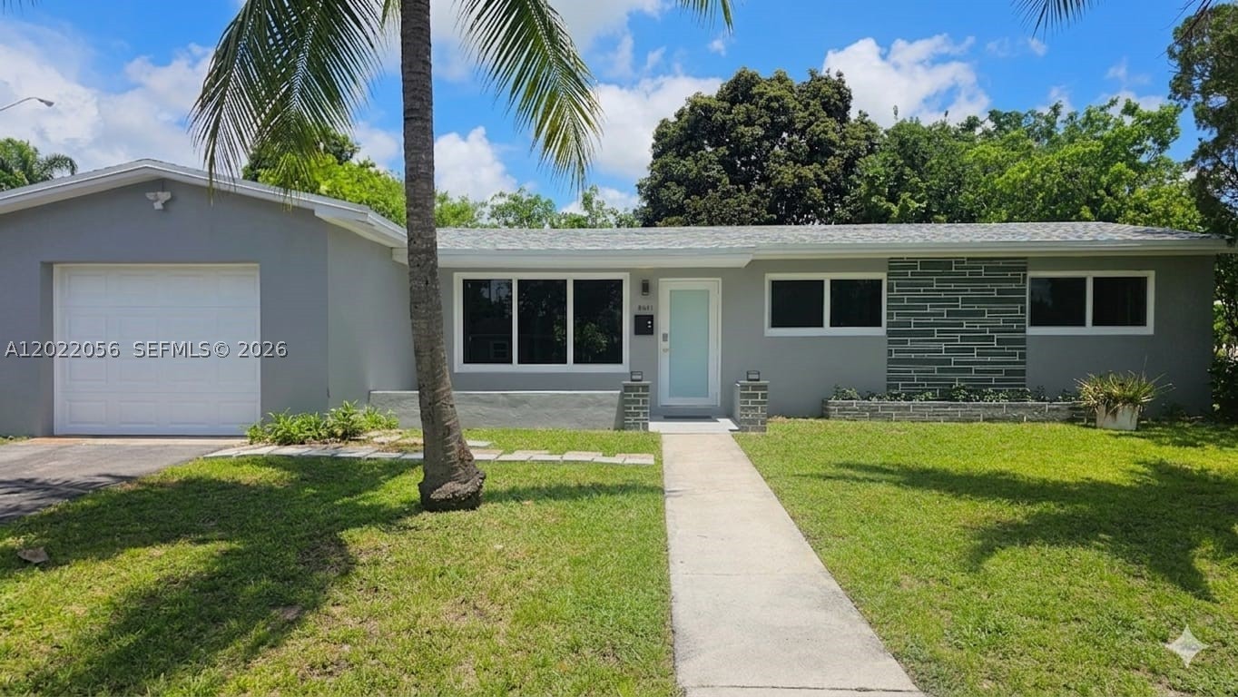 MODERN STYLE 4-bedroom, 2-bathroom single-family home in Pembroke Pines. 1,778 sq ft on an 8,712 sq ft lot. Brand-new roof, impact windows and doors throughout. Open-concept kitchen with wood cabinetry, finished countertops, and stainless steel appliances. Two designer bathrooms: primary bath features artisanal microcement walls, circular backlit mirror, built-in rain shower with mosaic stone floor; second bath offers floating wood-tone vanity with LED lighting, soaking tub, and built-in shelving. Wood-look luxury flooring throughout. Wood-finished closets, smart thermostat, smart front door, and integrated scent diffusion system connected to the A/C. Private garage, spacious backyard, quality designer interior doors. Minutes to I-595, I-75, top-rated Broward schools, Aventura Mall, and Hollywood Beach. Move-in ready — nothing to do but enjoy it.