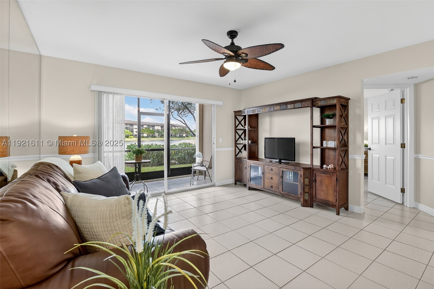 Your future home awaits in this first-floor, lakefront condo. Highly sought-after Karanda floorplan in Suffolk I, the newest part of Century Village. Upgraded kitchen features BRAND-NEW stainless-steel appliances and granite countertops with custom cabinetry in rich dark wood color. Breakfast nook overlooking front window area with flowing natural light. Spacious main areas include room for open concept dining and living room. Upgraded primary bedroom features sweeping lakefront views and ensuite bath with vanity, medicine cabinet, and pocket door to walk-in shower with sliding doors. Oversized walk-in closet with wire shelving + extra linen closet. Second bedroom features walk-in closet with wire shelving. Upgraded second bathroom features a vanity, medicine cabinet, and tub with sliding doors. Utility closet with shelving for extra storage. Ceiling fans in primary and second bedroom, living area, and breakfast nook. Recessed lighting and elegant chair rail in the main living areas. Window treatments throughout. Convenient in-unit clothes washer and dryer. Freshly painted walls and baseboards throughout (2025) and popcorn removed. Assigned parking just steps away. Accordion shutters in the back patio provide added peace of mind. Water heater (2020), A/C (2020), roof (2019). Pool, pickleball courts, exercise room, abundant amenities, 24/7 manned security and two entrance gates. 700 credit score minimum required, no rentals first 2 years. At least one owner must be 55+.