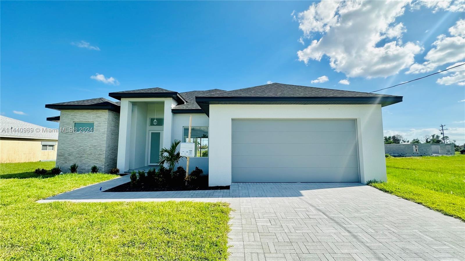 Stunning Brand New construction home is complete! This 3 bed + Den / 2.5 baths single family features a bright & open layout with a beautiful contemporary kitchen, stainless steel appliances, quartz countertops/ backsplash, high ceilings, modern floating bathroom vanities, spacious bedrooms with so much natural lighting. Porcelain flooring, quality finishes & chic light fixtures/ fans throughout. Convenient laundry room with sink. Spacious backyard with a covered & paved lanai which is perfect for entertaining! 2 car garage & plenty of space on the paved driveway. Perfectly located just blocks from supermarkets, schools, shops & more. This home definitely stands out from what is on the market in the area & it's priced to sell!