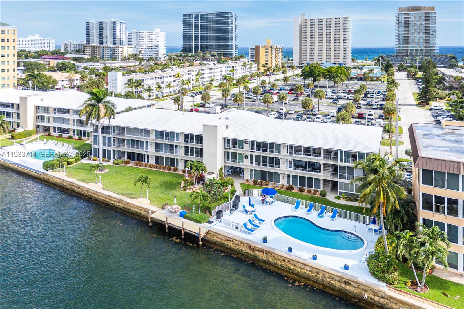 Get ready to live your best life in this top-floor boutique sanctuary where the Intracoastal is your backyard and the beach is just a block away! Offering a carefree lifestyle in this 23-unit co-op community with no land or recreational lease! You’ll love the sleek, open-concept kitchen, fully loaded with granite countertops, custom cabinetry, and stainless steel appliances. Enjoy having a front-row seat to the intracoastal from your A/C enclosed sunroom, featuring high-impact sliders. Recently updated second bath, Newer A/C, East/West exposure, heated pool and a common dock. This is the coastal retreat you’ve been waiting for which is only a short distance to the pier, top notch dining, and the sand!