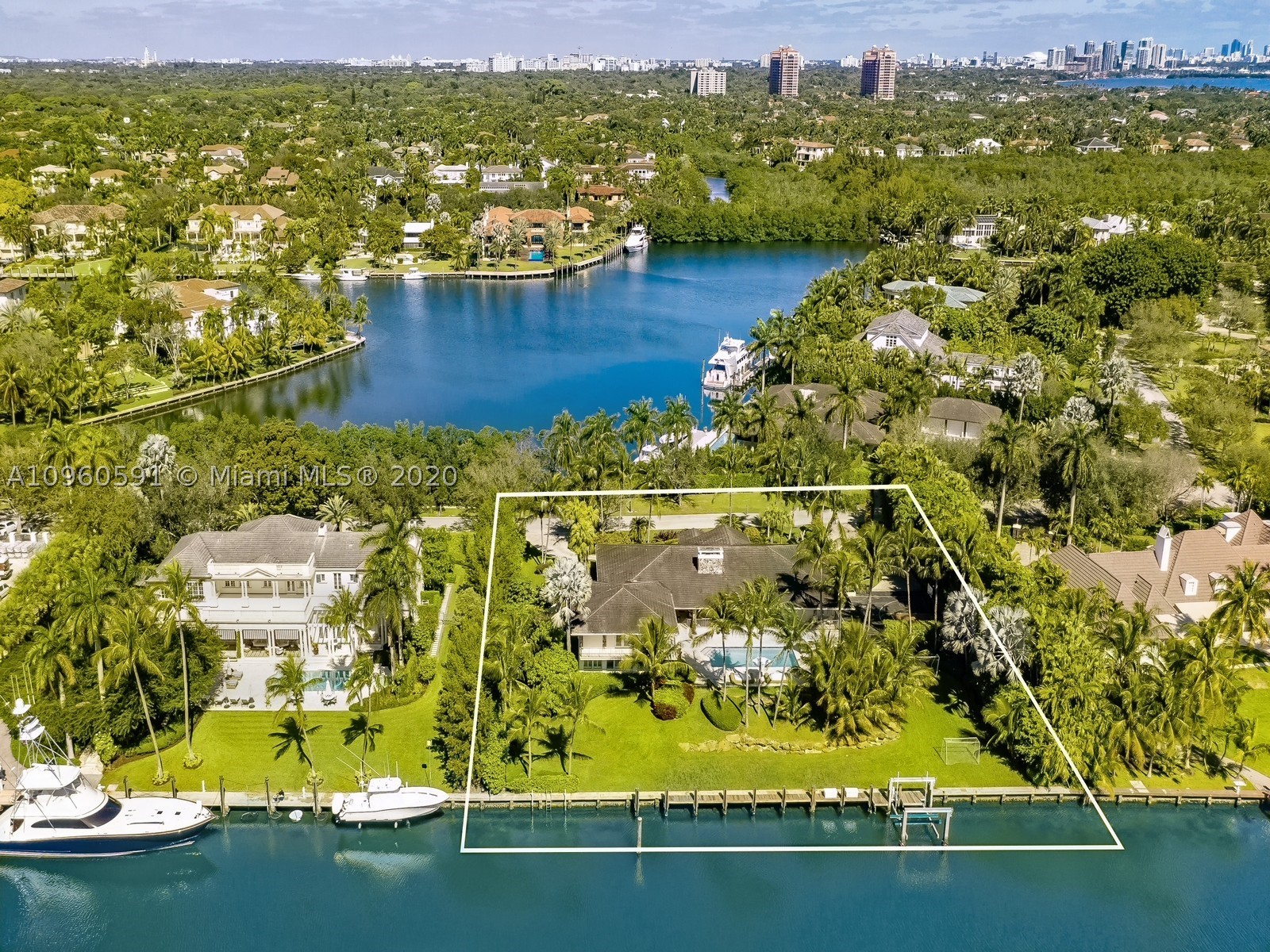 Extraordinary 200ft WATERFRONT Property with 80ft dock in the exclusive GABLES ESTATES Gated Community. With a lush 41,000 LOT this is the ideal family home for someone looking to own in one of the most coveted gated communities in CORAL GABLES. With a single story feel inside of its 7,341SF you will find 6 beds,6.5 baths including a beautiful master suite with its own private terrace, an expansive gym, home theatre, full bar, large chefs kitchen with water views, half court & 4 car garage ideal for a car aficionado including 70 KW full house Generator. Enjoy the amazing view of your 200ft of water with offering direct access to the ocean from the large outdoor area, complete with covered terraces and pool, truly a boaters dream. This property is the perfect opportunity to make it your own