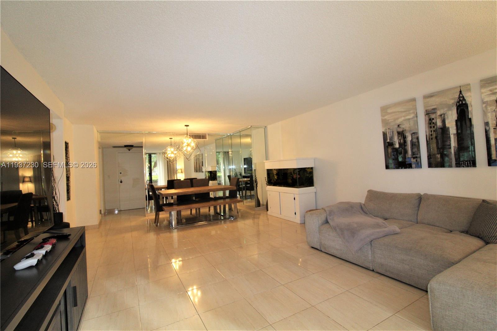 INVESTMENT OPPORTUNITY - Resort-style living at OLYMPUS. Experience tranquil garden views from this expansive 2-bedroom, 2-bath residence offering 1,280 sq. ft. of refined living space. Soaring ceilings and oversized closets create an open, sophisticated ambiance, while the original condition presents a rare opportunity to customize a luxury retreat to your taste. Priced to sell and located in the prestigious Olympus community in Hallandale Beach.
Surrounded by impeccably maintained grounds, this private residence overlooks a lush tropical setting and features tile flooring throughout with a soft, neutral palette. The generously sized terrace invites effortless indoor-outdoor living—perfect for morning coffee or evening relaxation.
The Olympus offers a full suite of resort-style amenities, including tennis courts, heated pools, valet service, billiards, 24-hour security, courtesy transportation, gas grills, picnic areas, storage, and covered parking. Investors are welcome. Ideally located just moments from the beach, shopping, and dining.
An exceptional opportunity to enjoy luxury, lifestyle, and location.