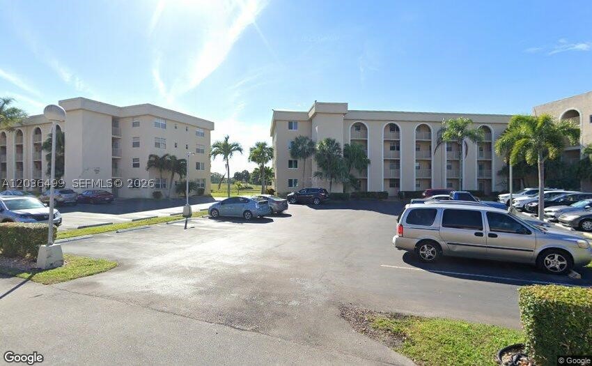 Welcome to Holiday Springs Village, a vibrant 55+ community offering comfort, resort-style amenities, and an active South Florida lifestyle. This beautifully maintained 1-bedroom, 1.5-bath second-floor residence features 867 square feet of thoughtfully designed living space with a bright, open layout that feels both spacious and inviting.

The oversized primary suite offers a walk-in closet and private bath, while the generous living and dining areas provide plenty of room for relaxing or entertaining. Enjoy your morning coffee or unwind in the evening on the screened patio overlooking golf course and waterview.

Residents of Holiday Springs Village enjoy access to a clubhouse, resort-style pool, fitness center, and a variety of social activities designed to foster connection and community. Conveniently located near shopping, dining, golf courses, parks, healthcare facilities, and major highways, this home offers the perfect blend of comfort, convenience, and carefree living.