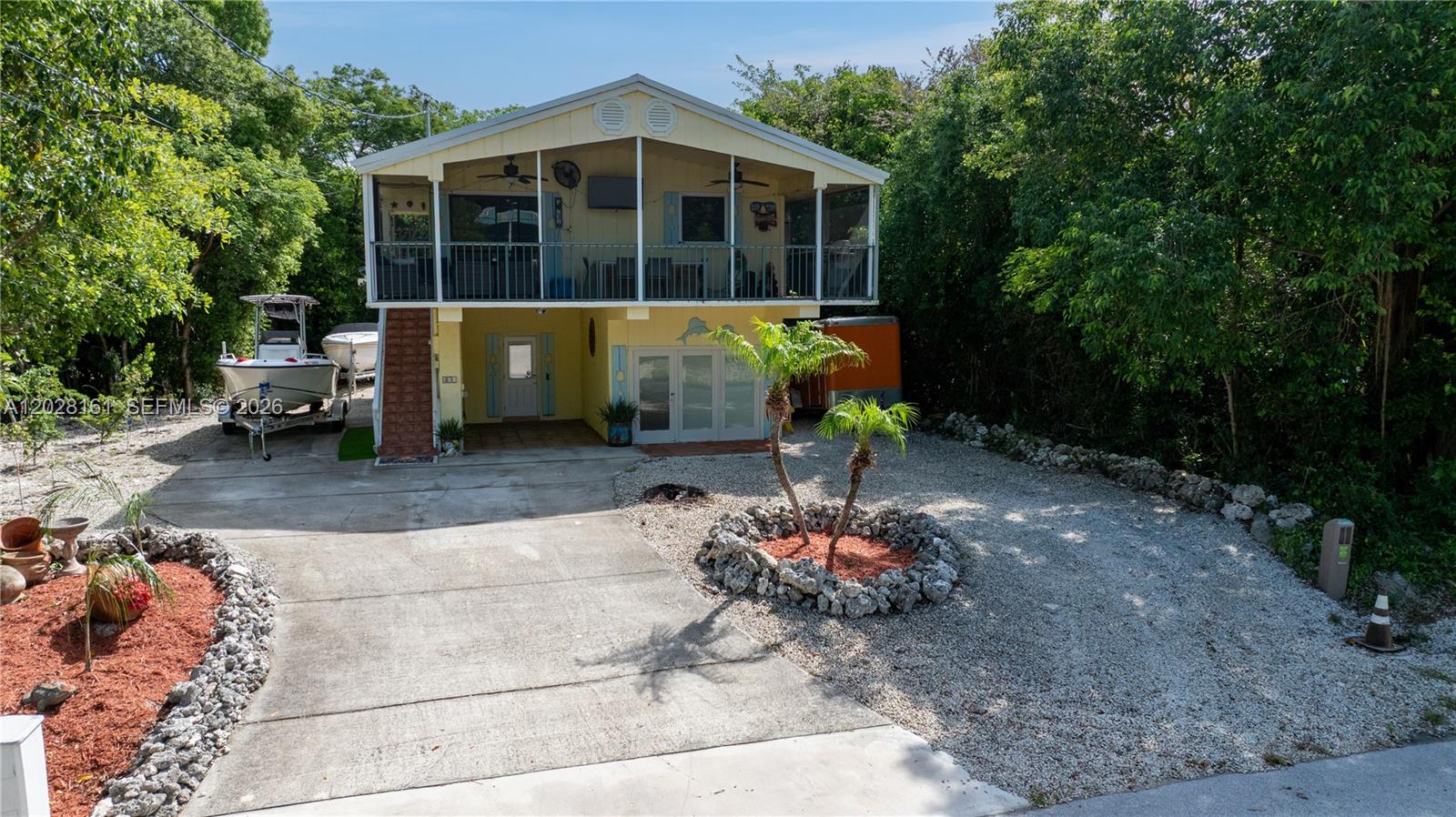 Welcome to this charming stilt home in the highly sought-after Bay Haven neighborhood, where there's something for everyone. Upstairs, you'll find an open-concept kitchen and living area, two comfortable bedrooms, and an updated bathroom. Step out onto the screened porch and relax with the evening breeze while surrounded by mature tropical landscaping.
Downstairs offers a versatile flex space complete with a bar area, creating the perfect setup for entertaining guests. There's also plenty of room to store all your boats, trailers, golf carts, and outdoor toys.
What truly sets this property apart is access to Bay Haven's private waterfront homeowners park. Residents enjoy exclusive amenities including a secure parking area, boat ramp, sandy beach, and a sunset pier. Imagine hopping on your golf cart, launching your boat for a day on the water, relaxing at the beach, and ending the evening with breathtaking sunset views from the pier—all without paying waterfront home prices. Best of all, there are no monthly HOA fees, just a minimal annual fee for these incredible amenities.
Conveniently located near shopping, dining, parks, medical facilities, and just a short drive to Miami, this home offers the perfect combination of Keys lifestyle, convenience, and value.