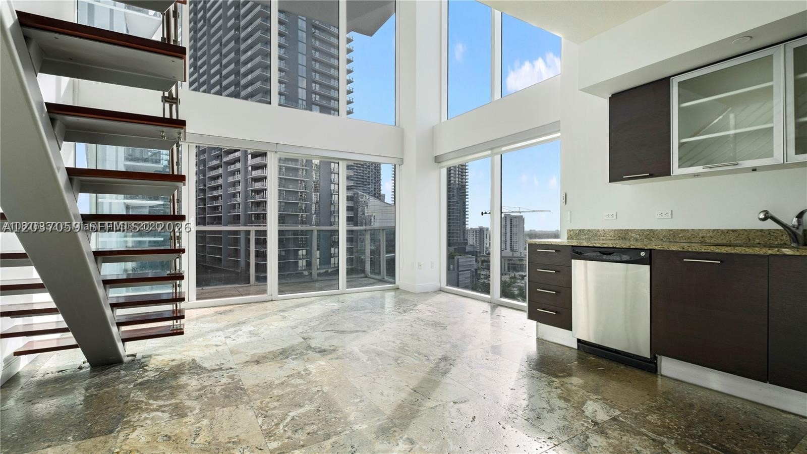 Beautiful corner unit two-story loft, open Master bedroom on the second floor. 2 private balconies. Extra large built-in walk in closet. Guest room and 2nd full bathroom on the first floor. washer and dryer in the unit. Spectacular views of the river and Brickell. Walking distance to BBC, shops and restaurants, Metro Mover, and market. Amazing amenities 2 level fitness center and more. *Loft-style floor plan. Second floor master bedroom is completely open (no walls). Second room on first floors has walls, door and private balcony.*