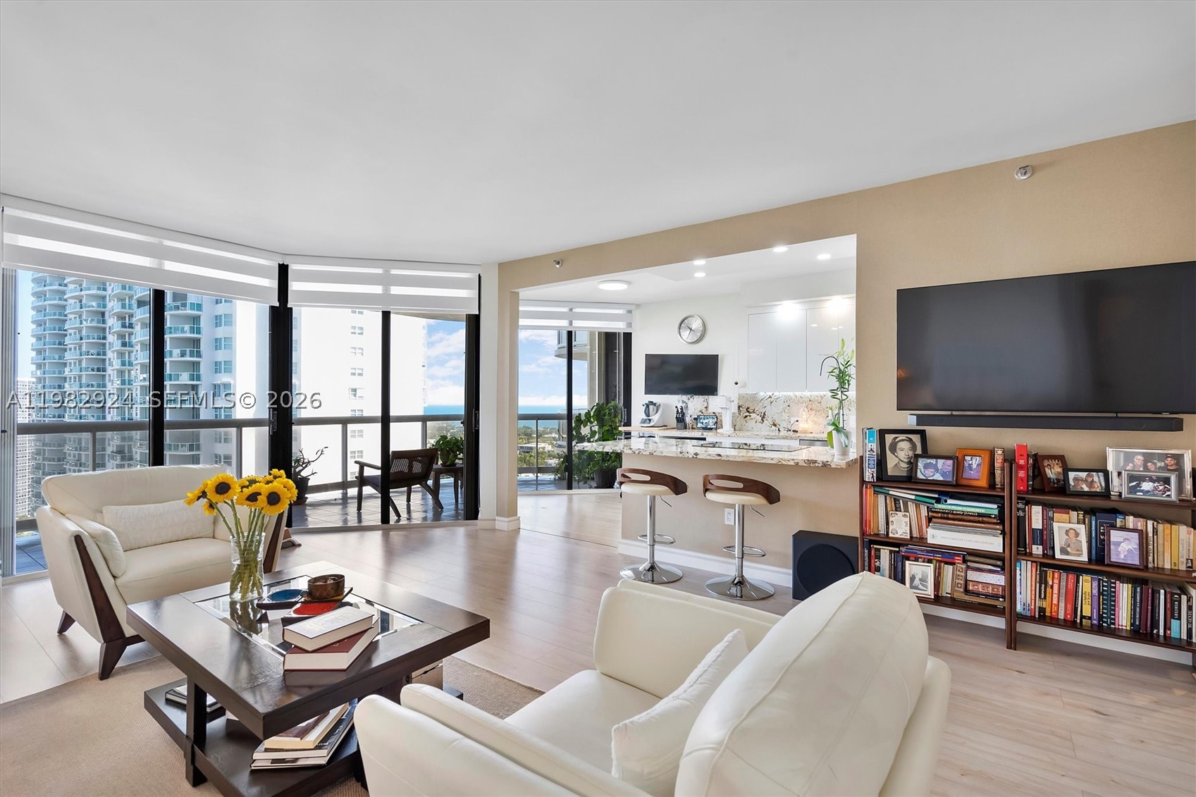 Opportunity is calling—step into this high-floor gem with breathtaking views of the Intracoastal Waterway and lush golf courses, where every day begins with a stunning sunrise and ends with a spectacular sunset.

This expansive 1,622 sq. ft. condo boasts a completely remodeled kitchen, featuring newer appliances and modern finishes, that opens seamlessly to the living area with the beauty of natural stone countertop, making it perfect for both relaxing and entertaining. Luxury vinyl flooring adds warmth and style, while custom-built closets provide smart storage solutions. LED recessed lighting, smooth ceilings, and a brand-new A/C (installed in 2025) complete this impeccably maintained space.

Convenience is key here, with assigned parking for one vehicle and a second spot available. Nestled within a full-amenity waterfront building along Aventura's iconic Country Club Drive, you'll enjoy a lifestyle of comfort and sophistication.

Lovingly cared for by its current owners, this home is ready for you to move in and make it your own. Don’t let this opportunity pass you by!