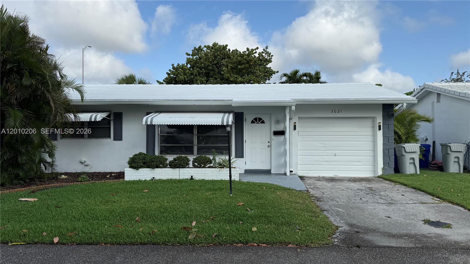 **Handyman Special and Priced Accordingly** This Charming 2-bedroom, 1-bath single-family home located in the a sought-after desirable Leisureville 55+ community in Pompano Beach just needs a little TLC. Features include a screened-in patio, attached garage, and spacious living areas. Newer AC & Hot Water Heater. Residents enjoy resort-style amenities including community pools, shuffleboard, and an active clubhouse lifestyle. Conveniently located near shopping, dining, golf, and beaches. Low-maintenance living at its best! Photos are actual current as/is condition.